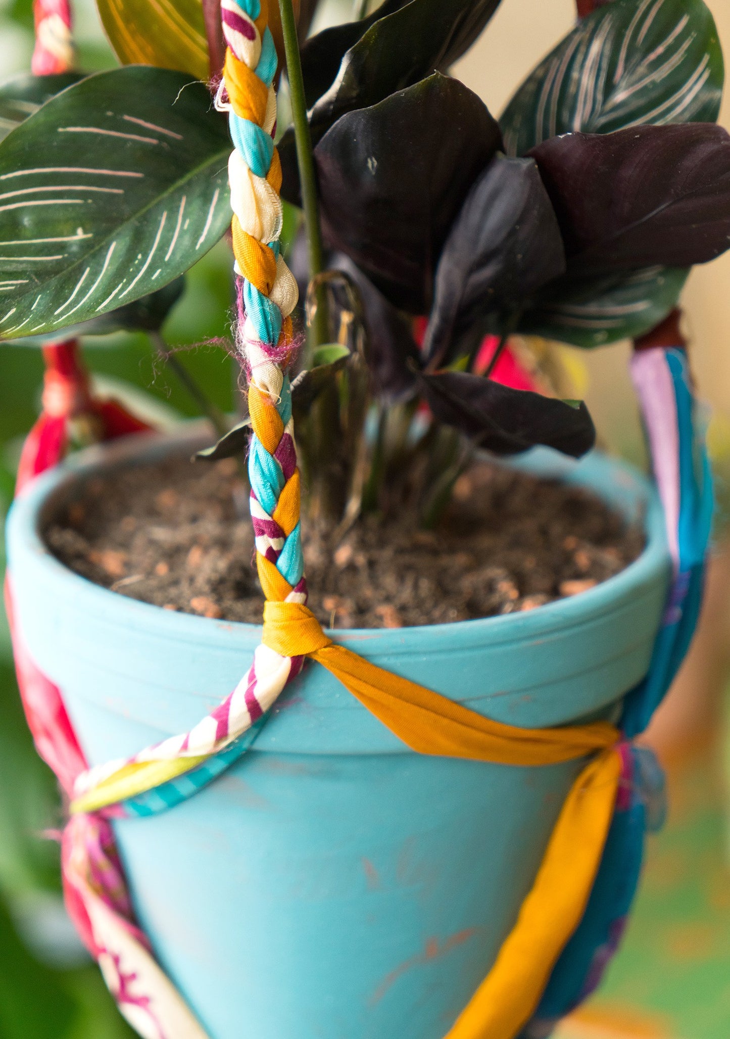 Hanging plant holder made from recycled saris. Eco friendly plant hanger. Colourful home decor.