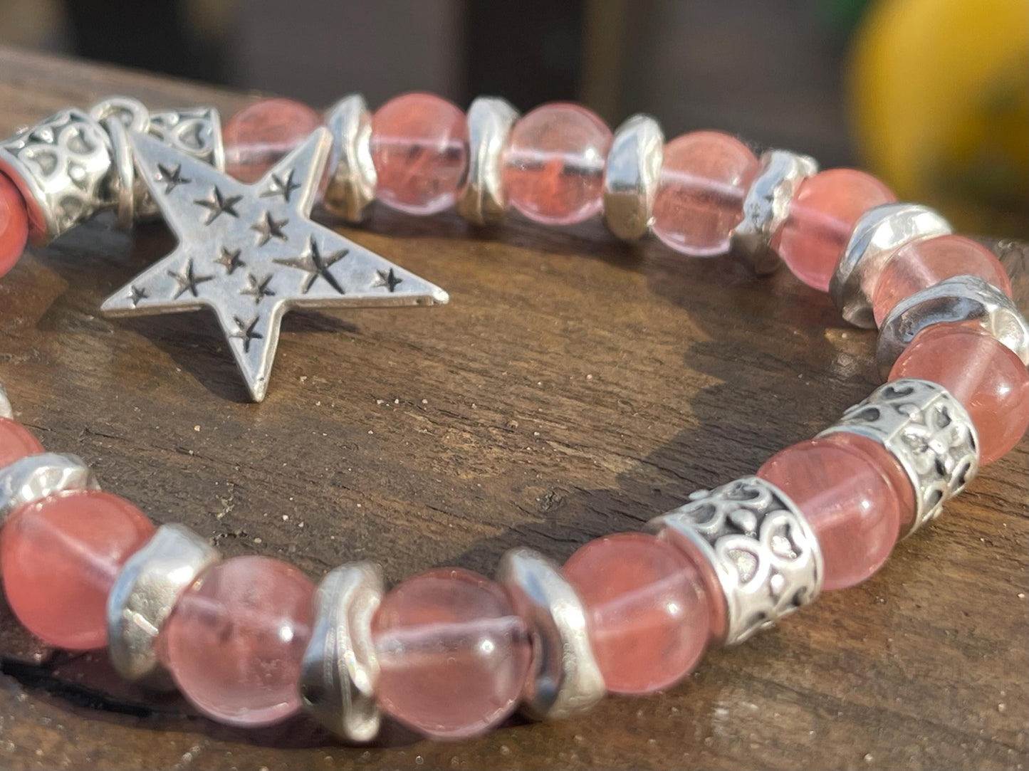 Strawberry quartz bracelet showcasing a silver star. Star jewellery, ethical jewellery, handmade pink bracelet. Congratulations gift.