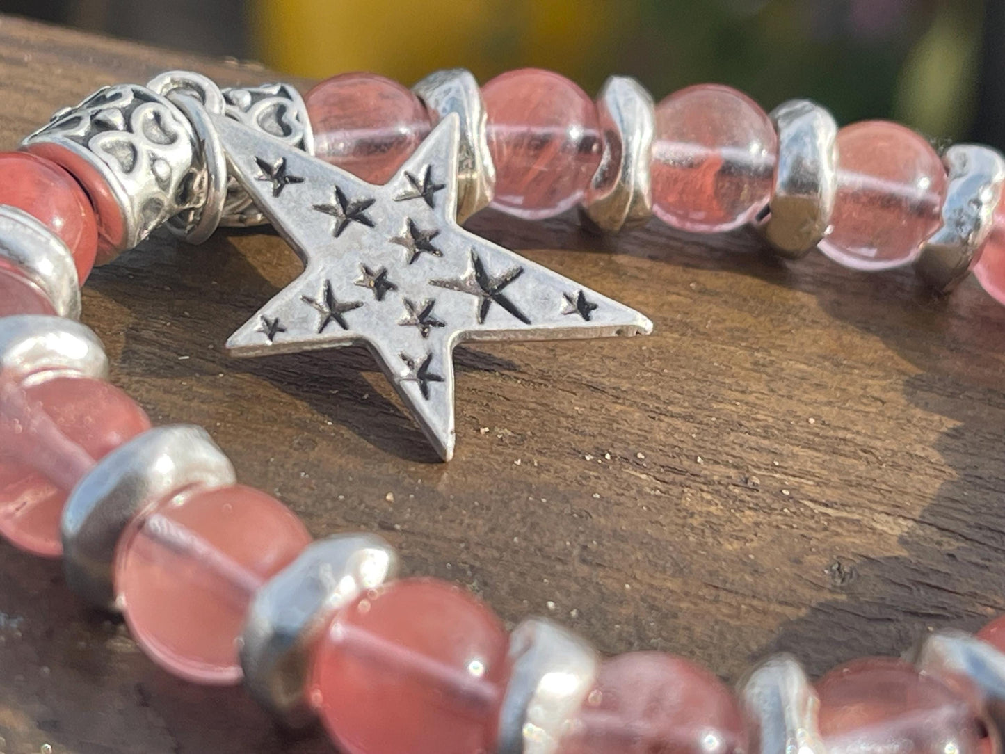 Strawberry quartz bracelet showcasing a silver star. Star jewellery, ethical jewellery, handmade pink bracelet. Congratulations gift.