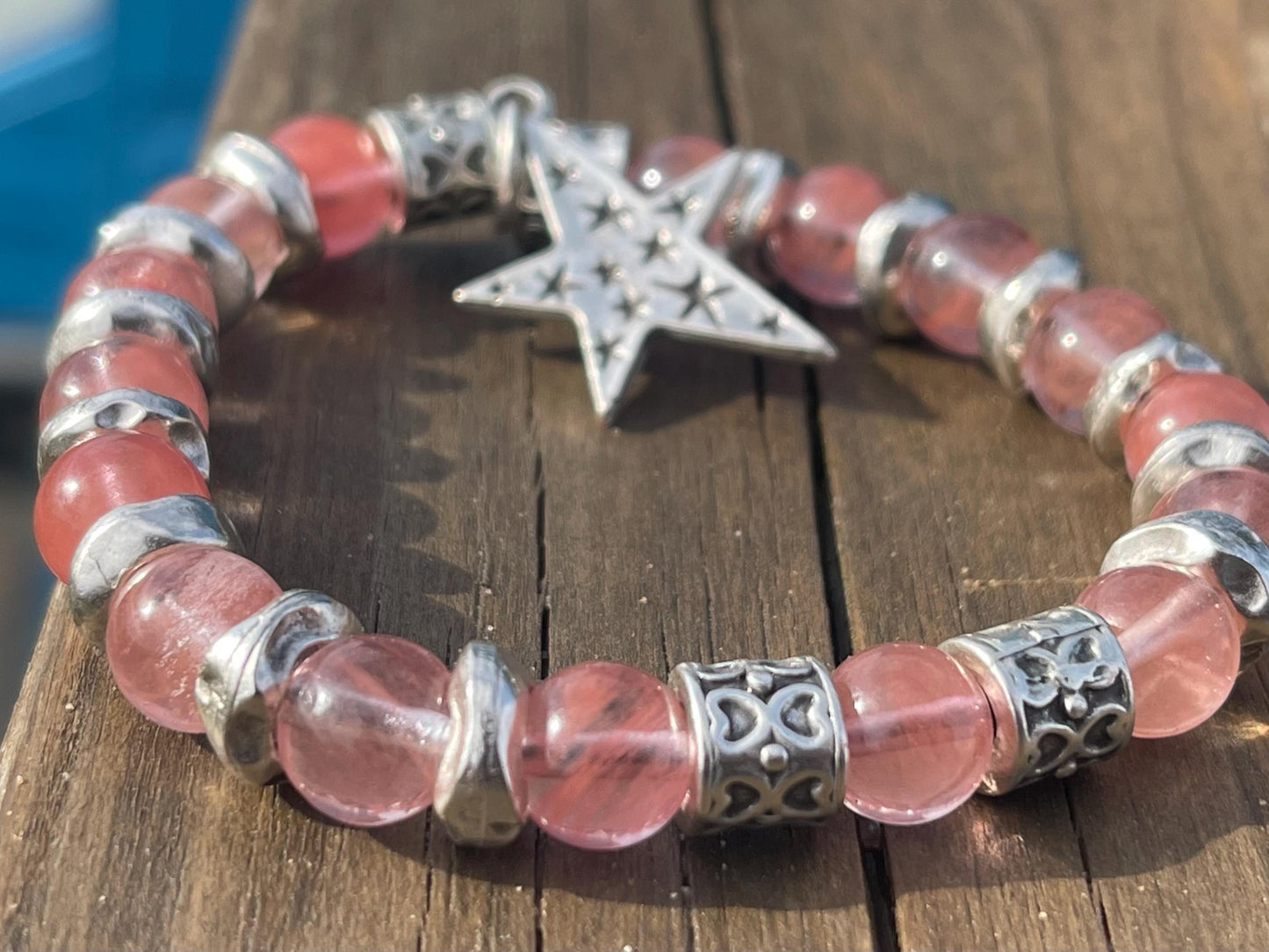 Strawberry quartz bracelet showcasing a silver star. Star jewellery, ethical jewellery, handmade pink bracelet. Congratulations gift.