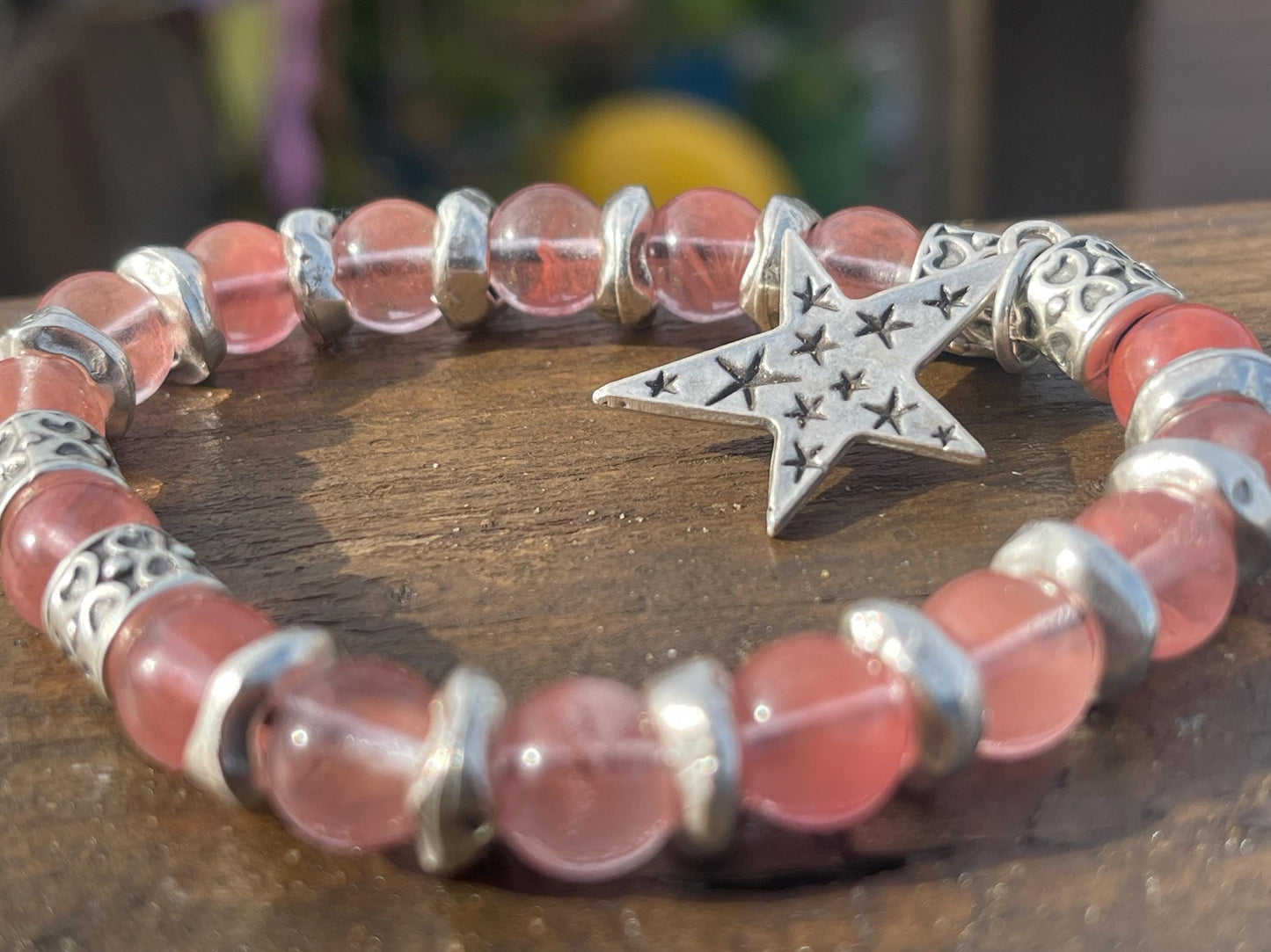 Strawberry quartz bracelet showcasing a silver star. Star jewellery, ethical jewellery, handmade pink bracelet. Congratulations gift.