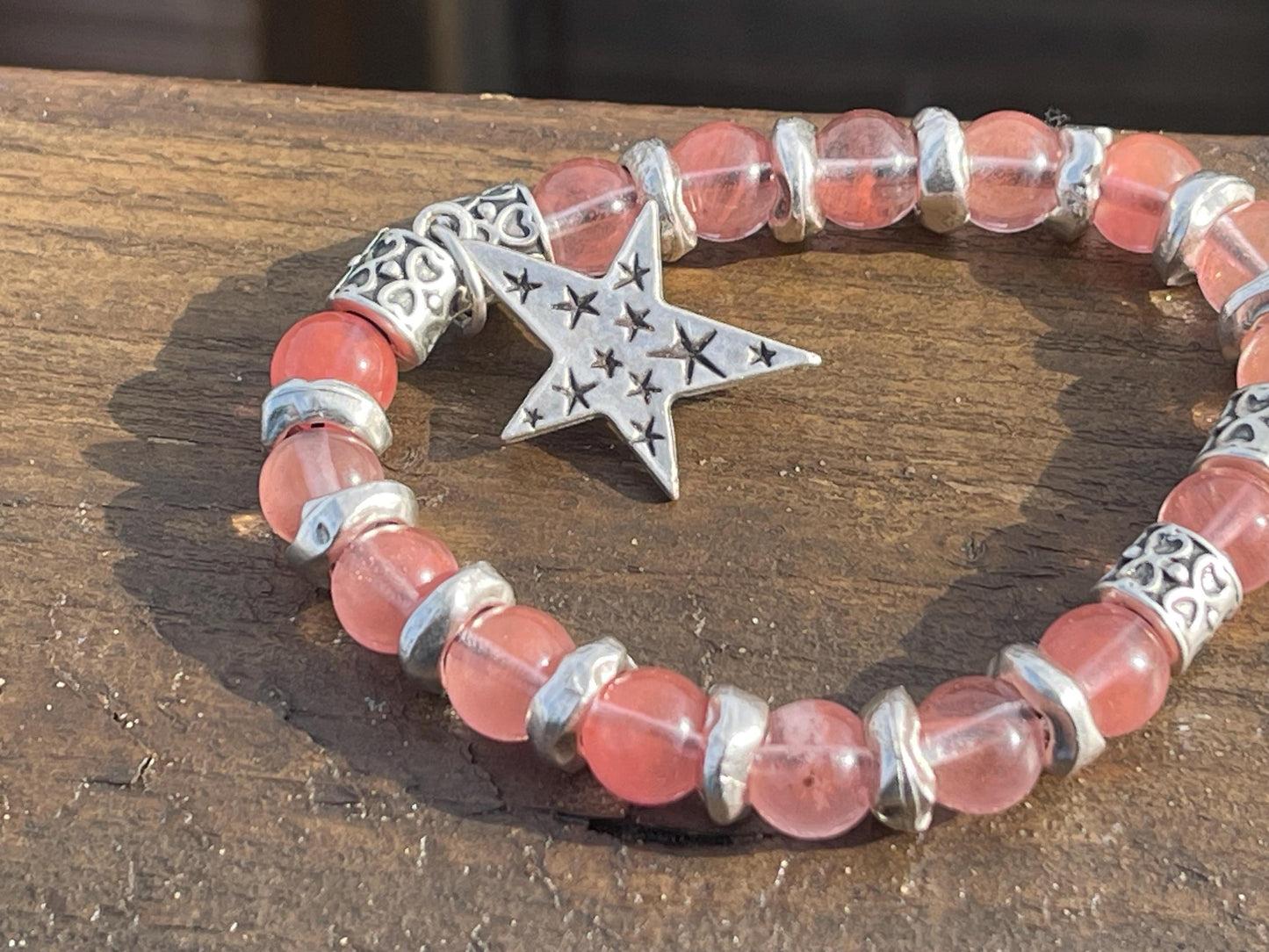 Strawberry quartz bracelet showcasing a silver star. Star jewellery, ethical jewellery, handmade pink bracelet. Congratulations gift.