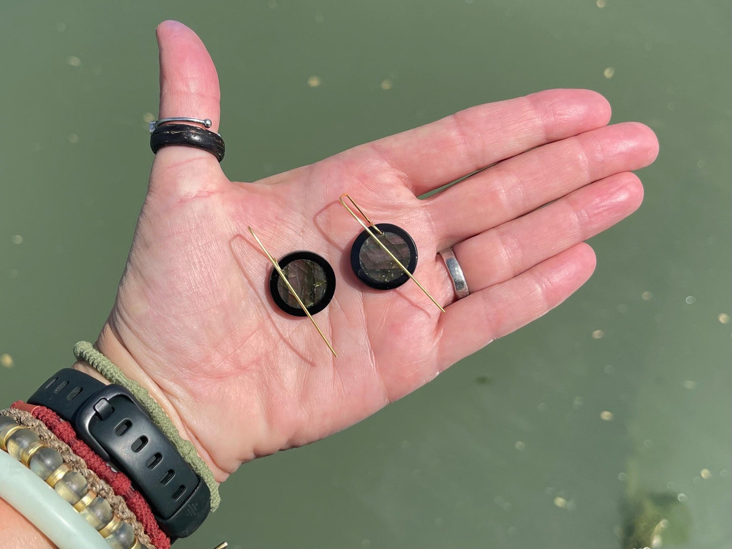 Ethically sourced labradorite and black onyx earrings held on recycled brass. Ethical jewellery, labradorite jewellery. Boho unique earrings