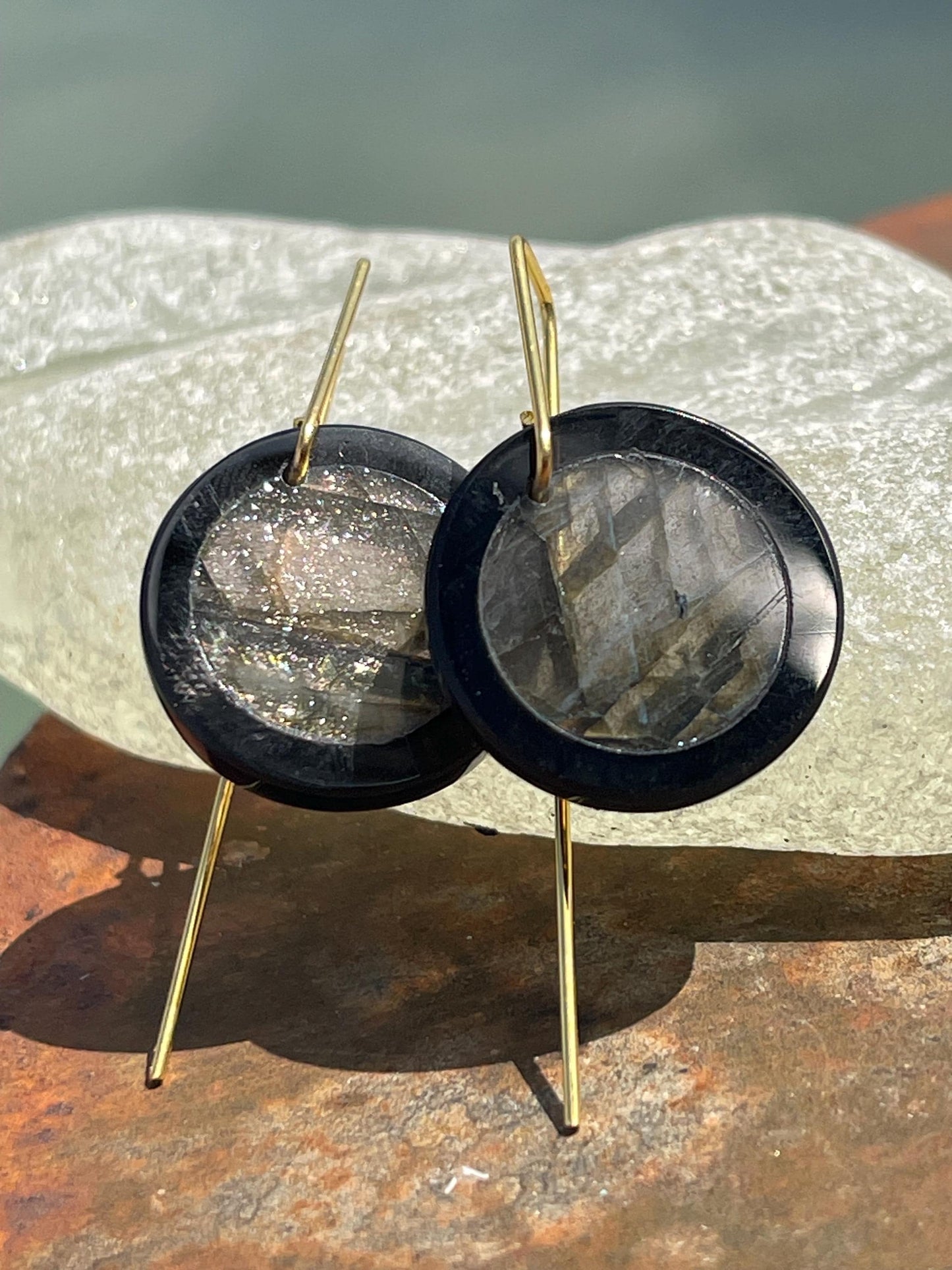 Ethically sourced labradorite and black onyx earrings held on recycled brass. Ethical jewellery, labradorite jewellery. Boho unique earrings