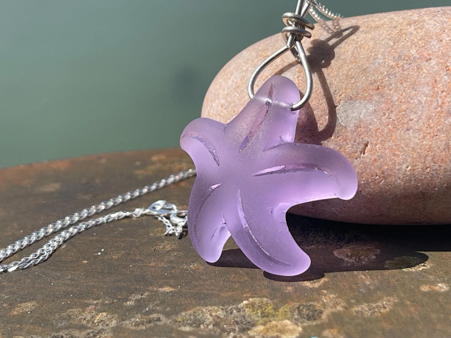 Eco friendly glass necklace on a sterling silver chain showcasing a pink starfish pendant, starfish necklace, ethical jewellery