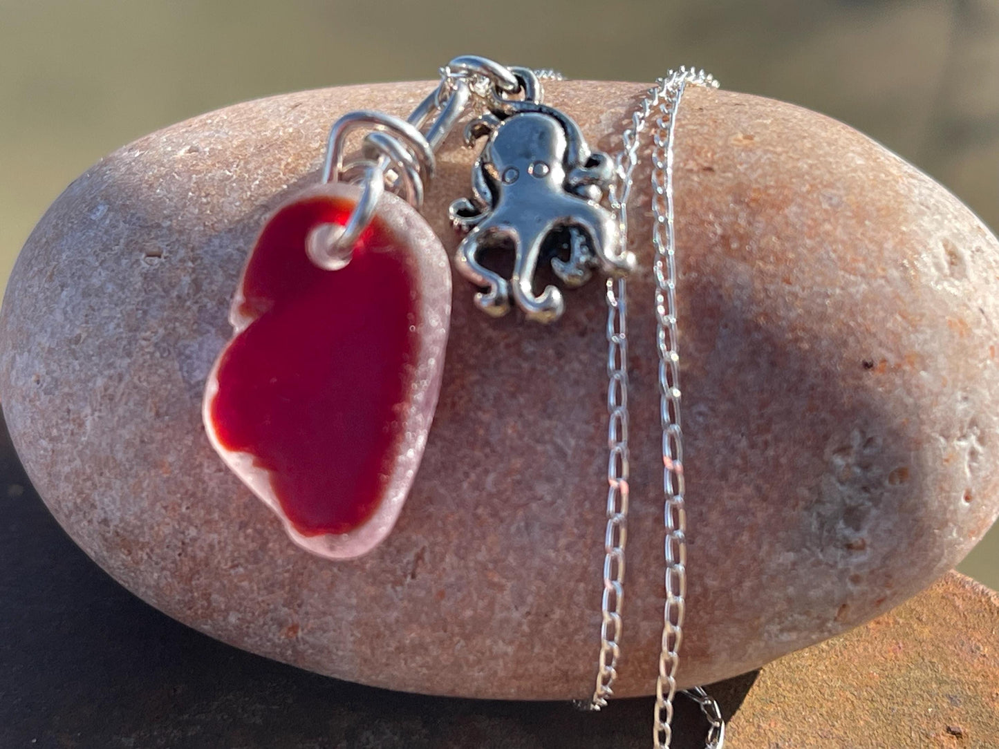 Eco friendly sea glass necklace on a sterling silver chain showcasing a little octopus. Octopus pendant, octopus necklace, ethical jewellery
