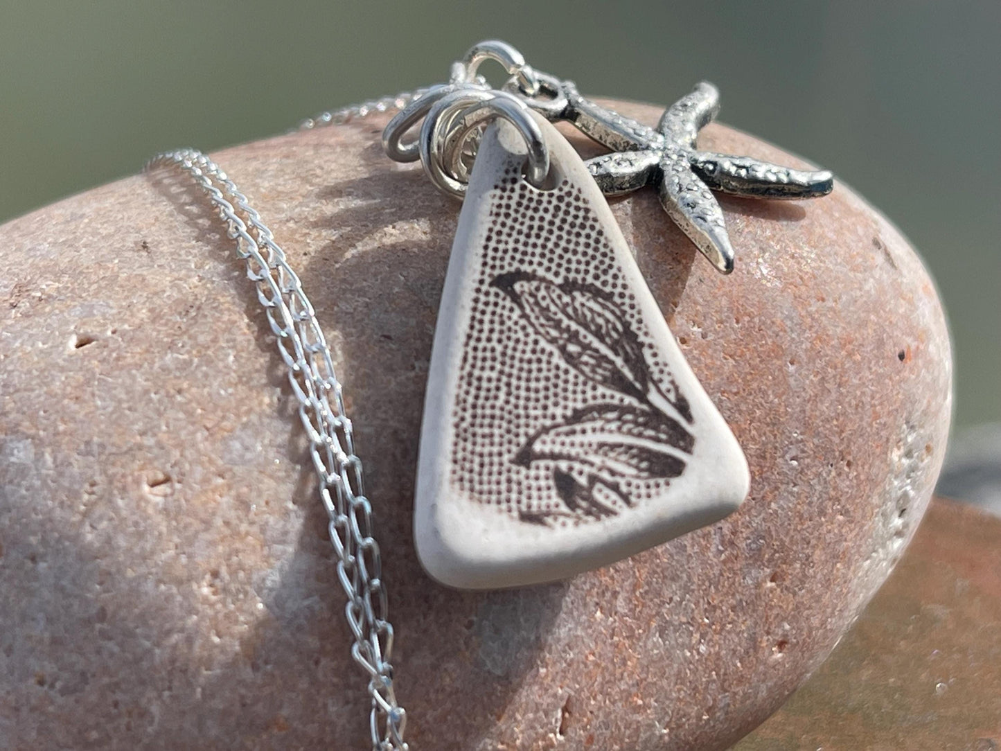 Eco friendly sea ceramic necklace on a sterling silver chain showcasing a little starfish pendant, starfish necklace, ethical jewellery