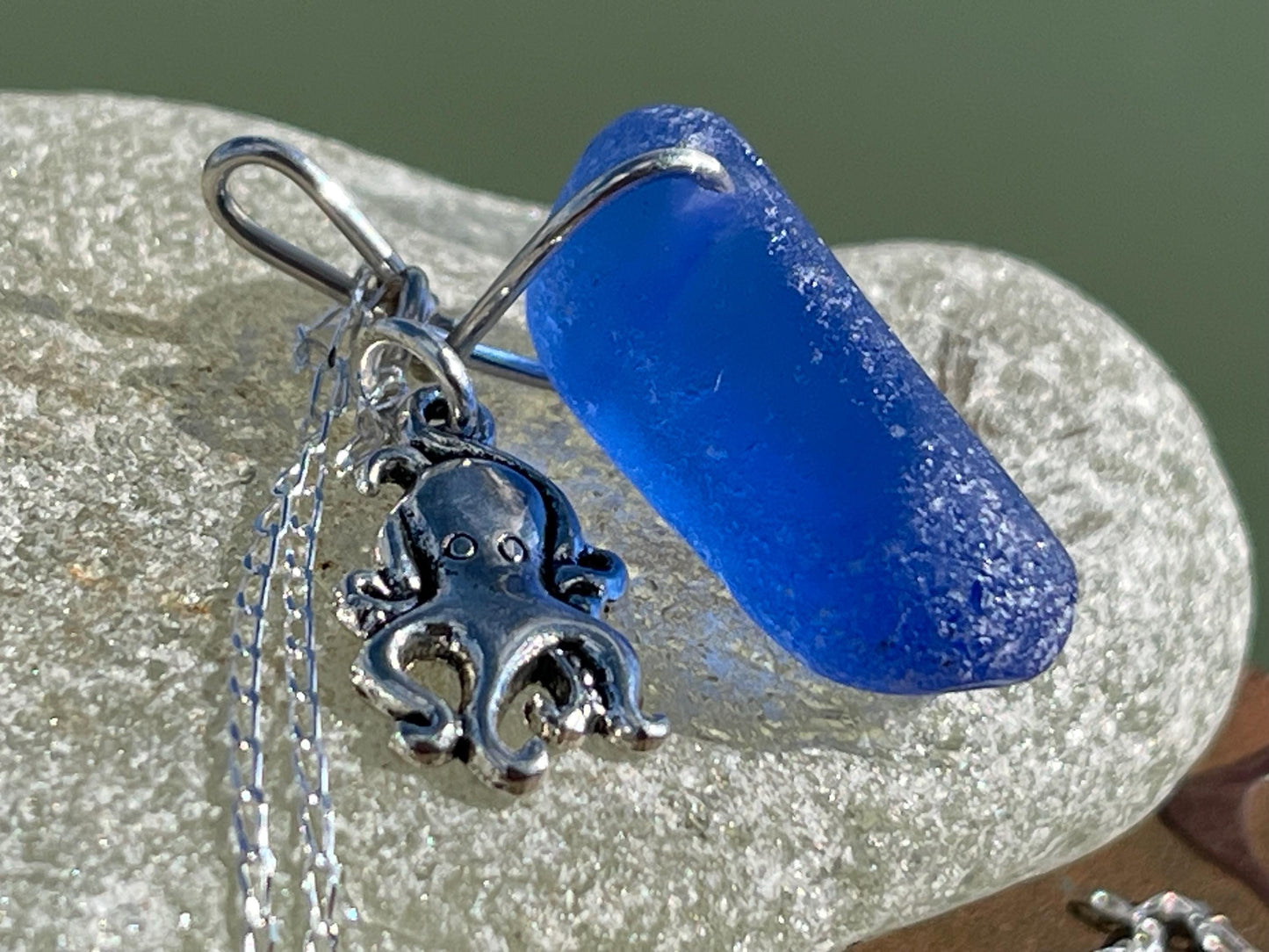 Eco friendly sea glass necklace on a sterling silver chain showcasing a little octopus. Octopus pendant, octopus necklace, ethical jewellery