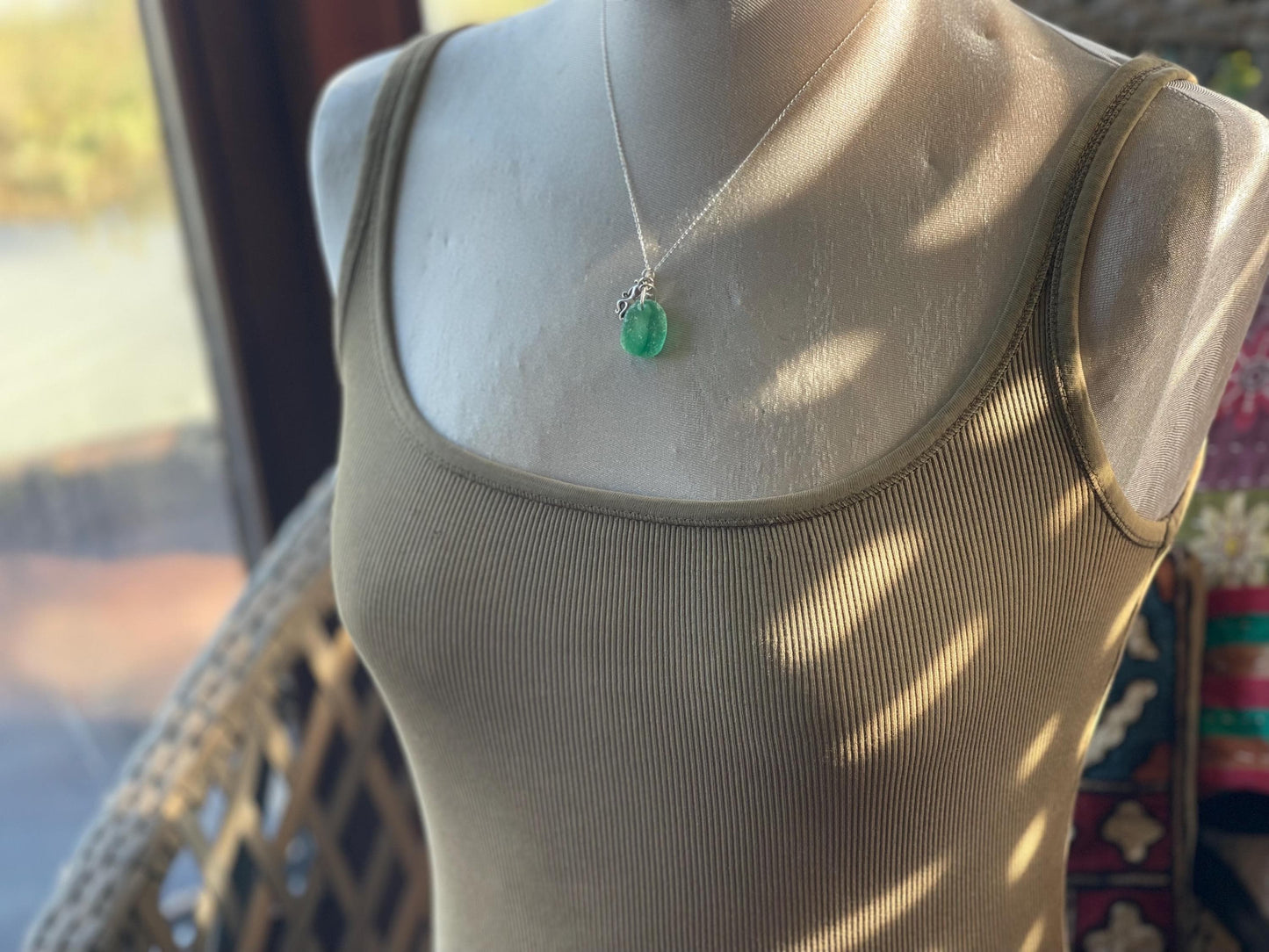 Eco friendly sea glass necklace on a sterling silver chain showcasing a little octopus. Octopus pendant, octopus necklace, eco jewellery