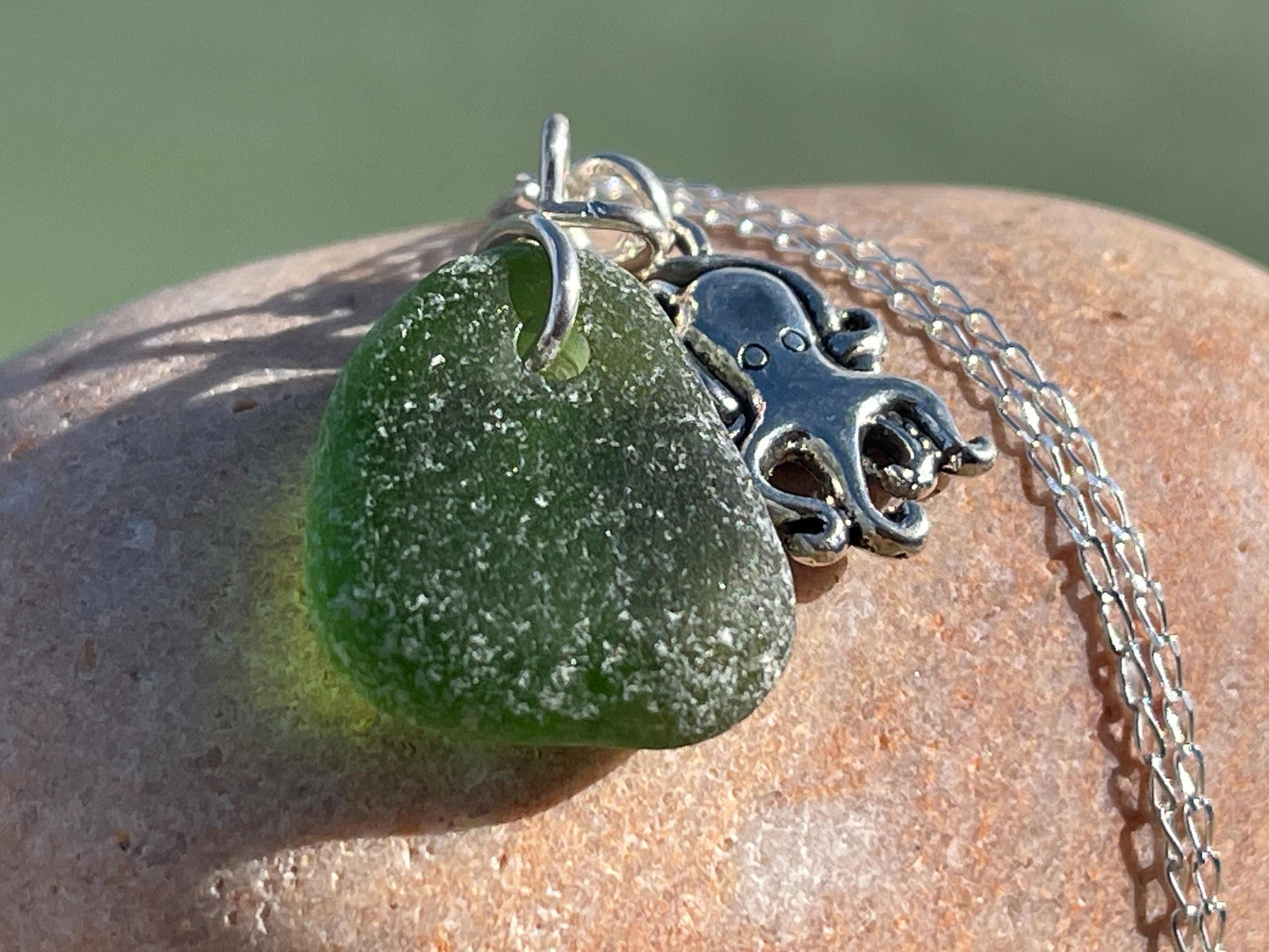 Eco friendly sea glass necklace on a sterling silver chain showcasing a little octopus. Octopus pendant, octopus necklace, ethical jewellery