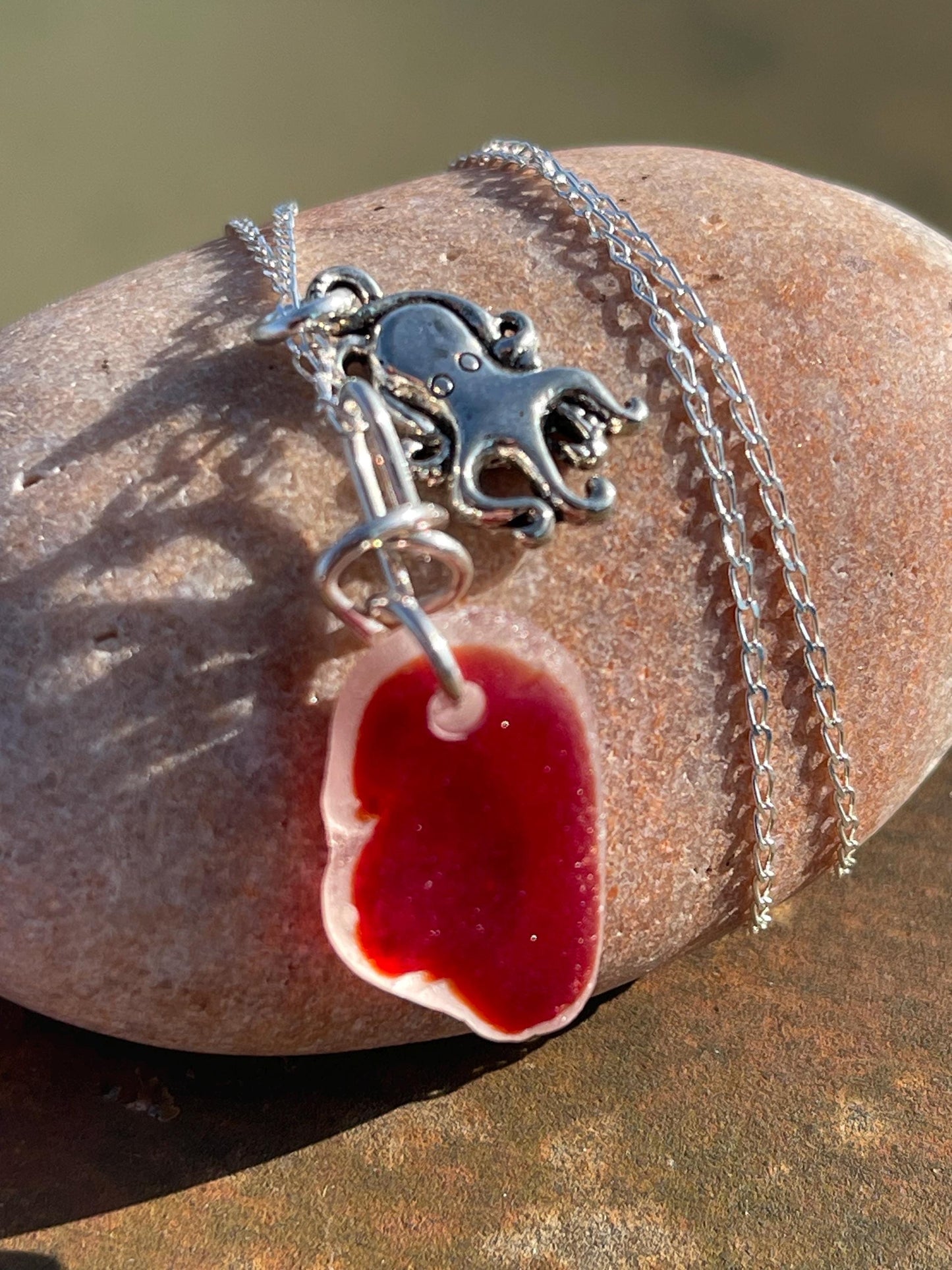 Eco friendly sea glass necklace on a sterling silver chain showcasing a little octopus. Octopus pendant, octopus necklace, ethical jewellery
