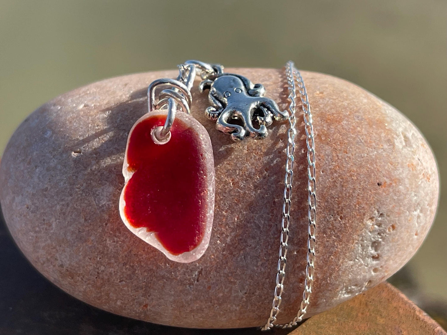Eco friendly sea glass necklace on a sterling silver chain showcasing a little octopus. Octopus pendant, octopus necklace, ethical jewellery