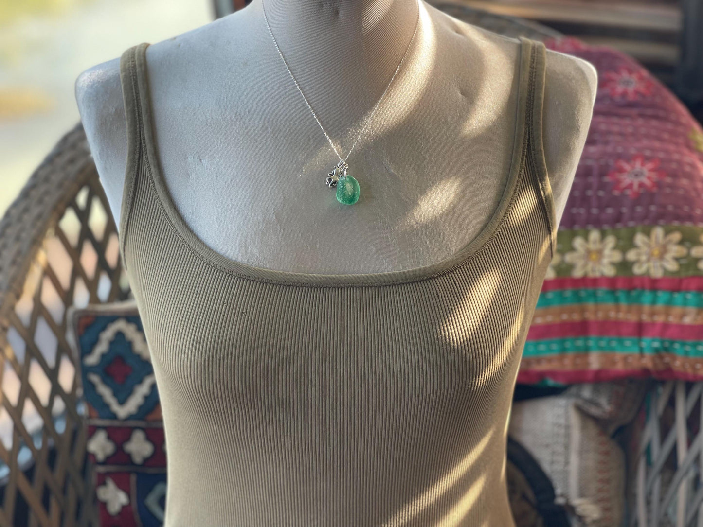 Eco friendly sea glass necklace on a sterling silver chain showcasing a little octopus. Octopus pendant, octopus necklace, eco jewellery