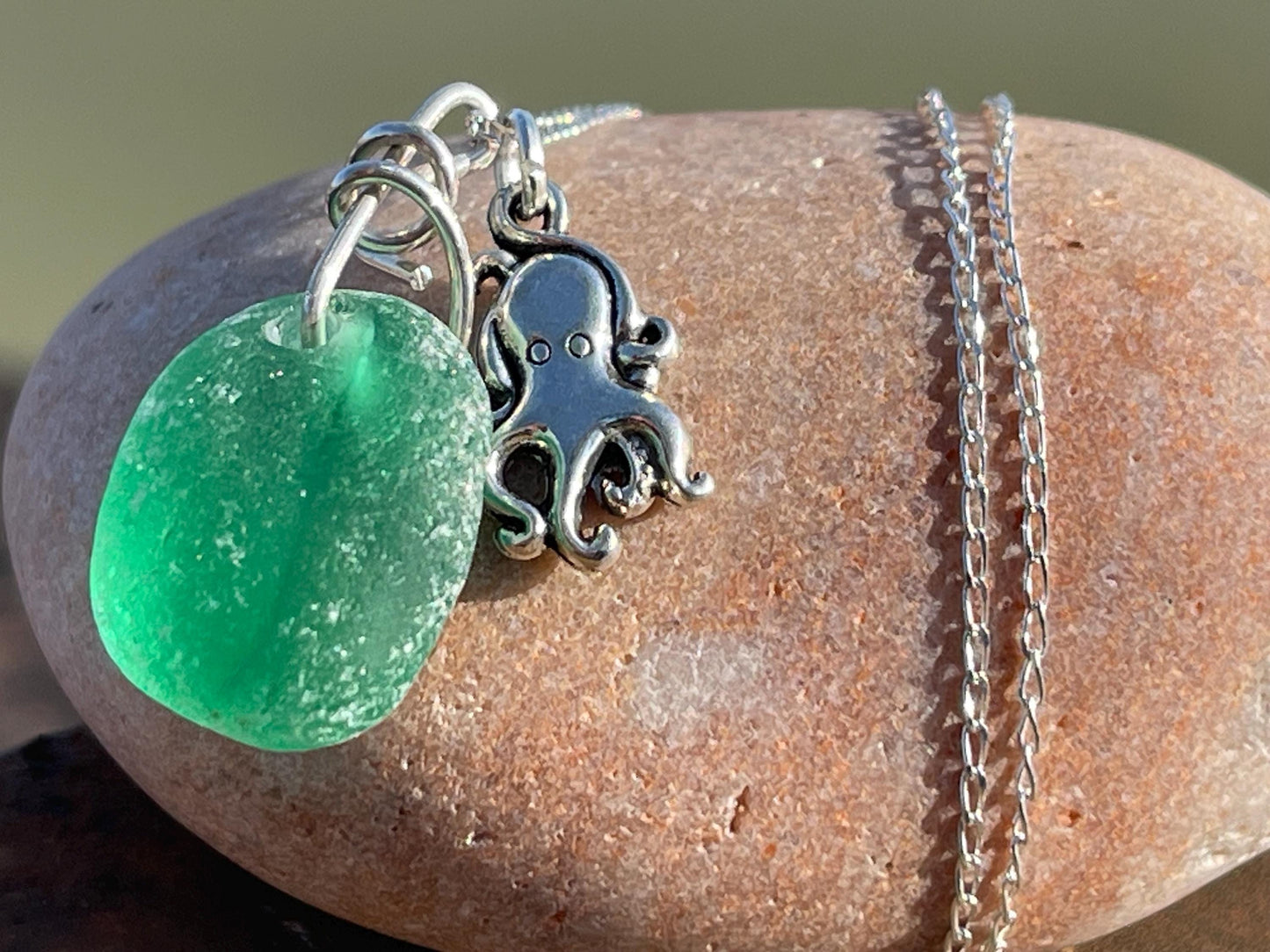 Eco friendly sea glass necklace on a sterling silver chain showcasing a little octopus. Octopus pendant, octopus necklace, eco jewellery