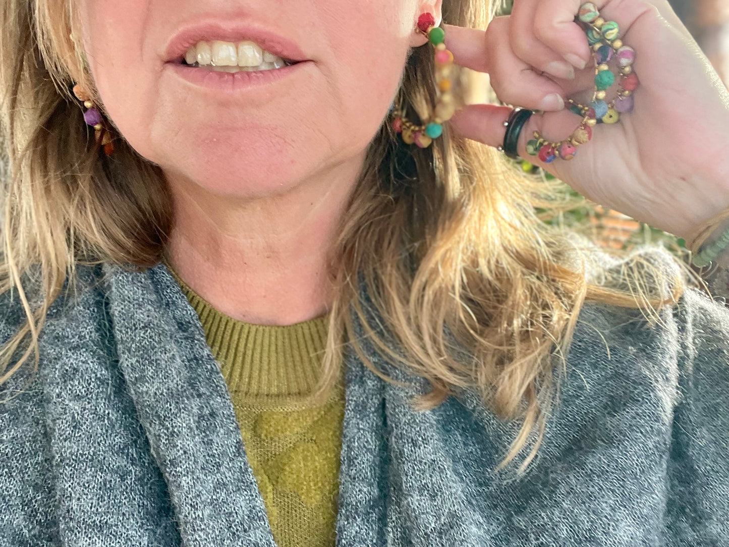 Handmade earrings made from waste textiles