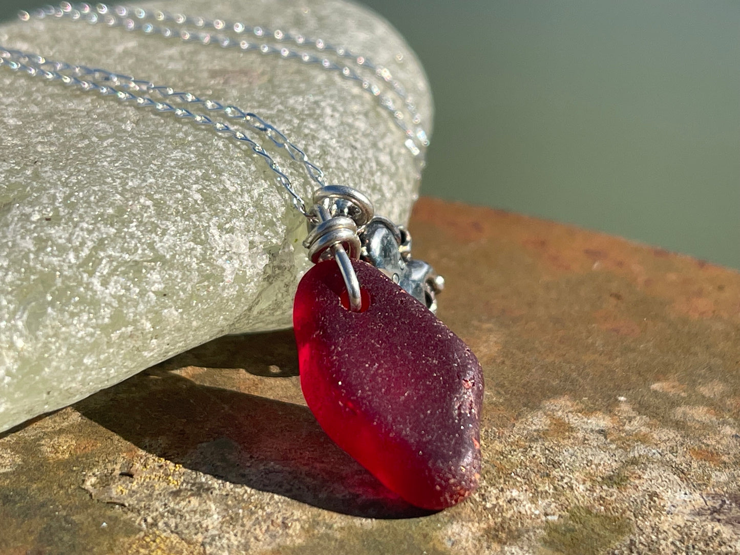 Eco friendly sea glass necklace on a sterling silver chain showcasing a little octopus. Octopus pendant, octopus necklace, ethical jewellery