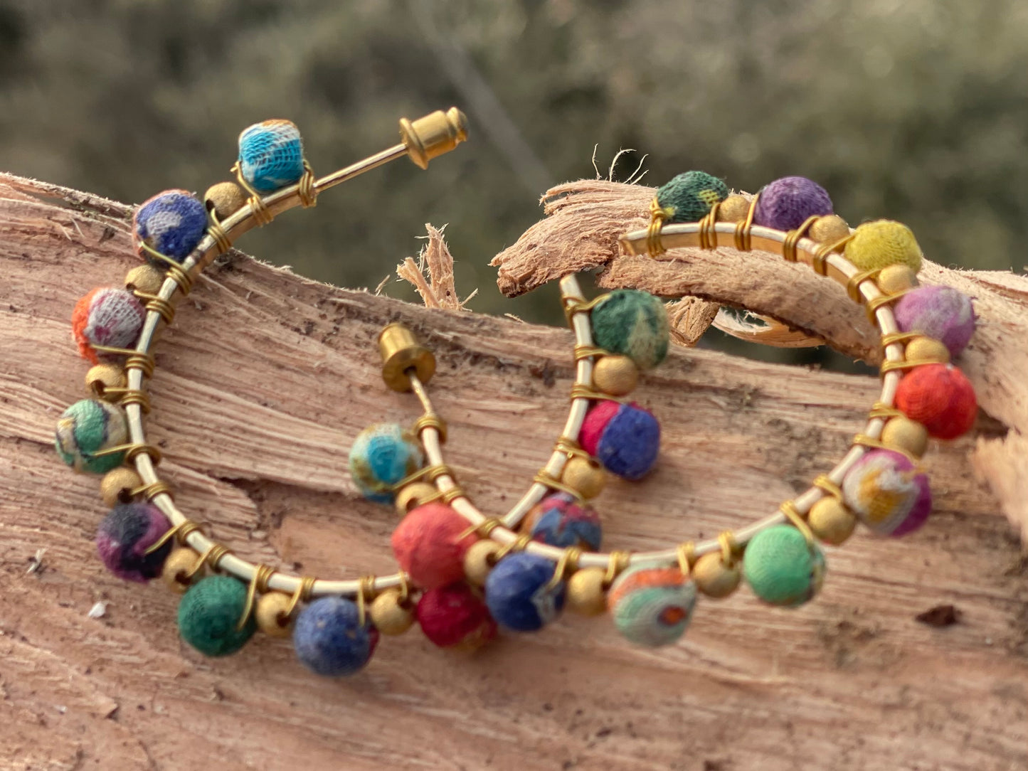 Handmade earrings made from waste textiles