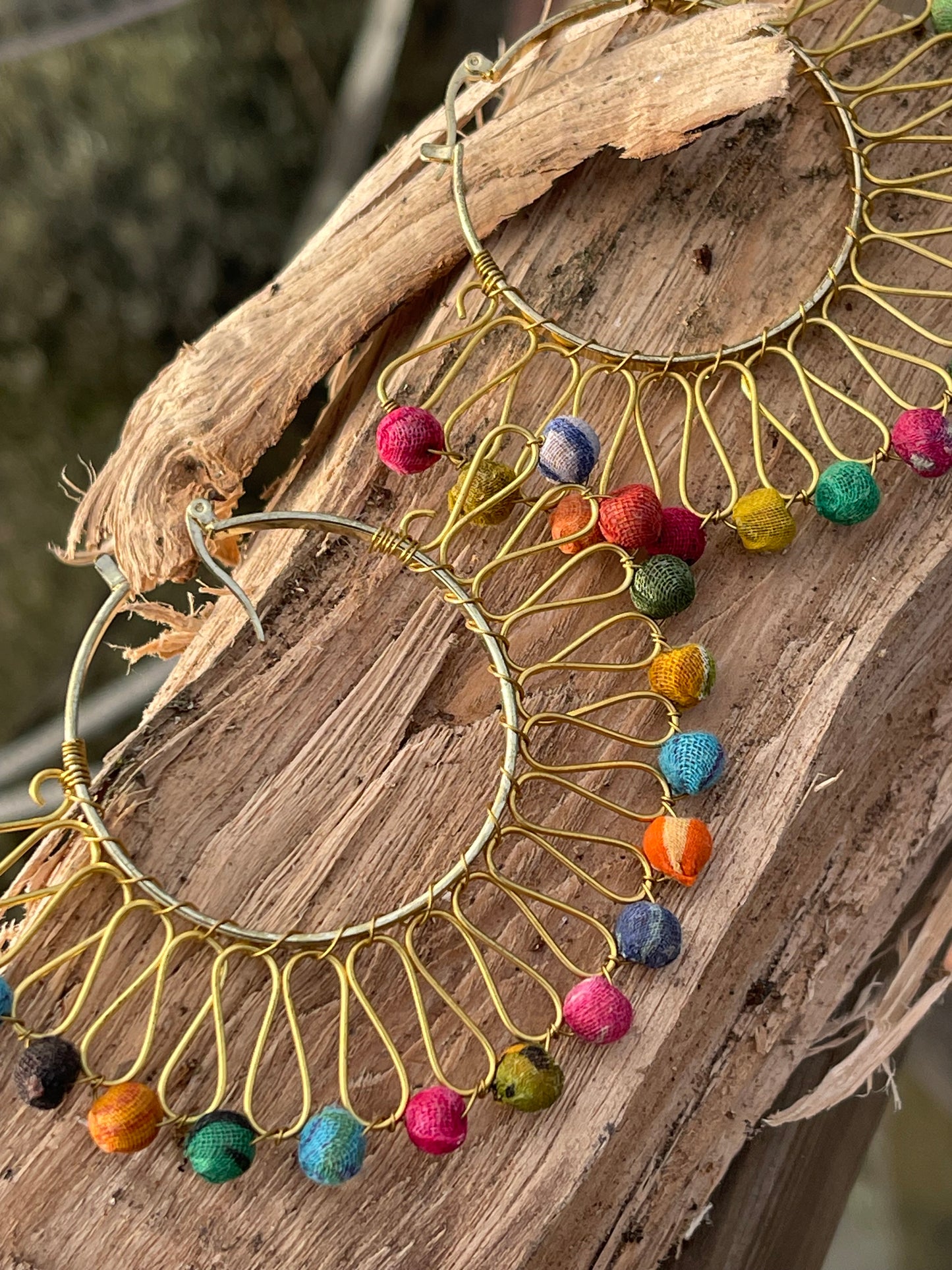 Handmade earrings made from waste textiles