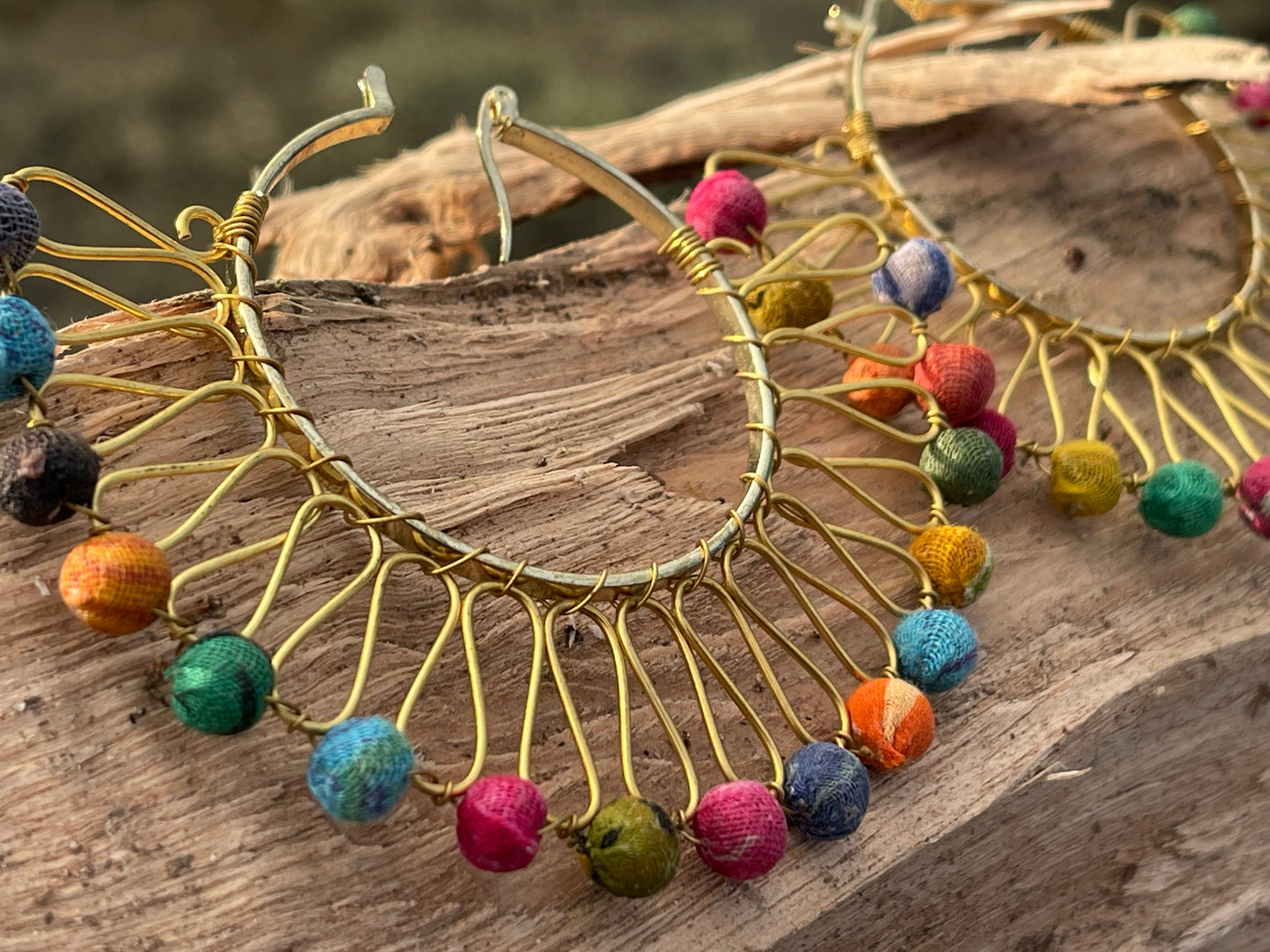 Handmade earrings made from waste textiles