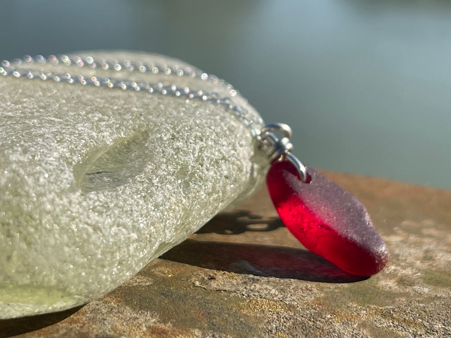 Eco friendly sea glass necklace on a sterling silver chain showcasing a little octopus. Octopus pendant, octopus necklace, ethical jewellery