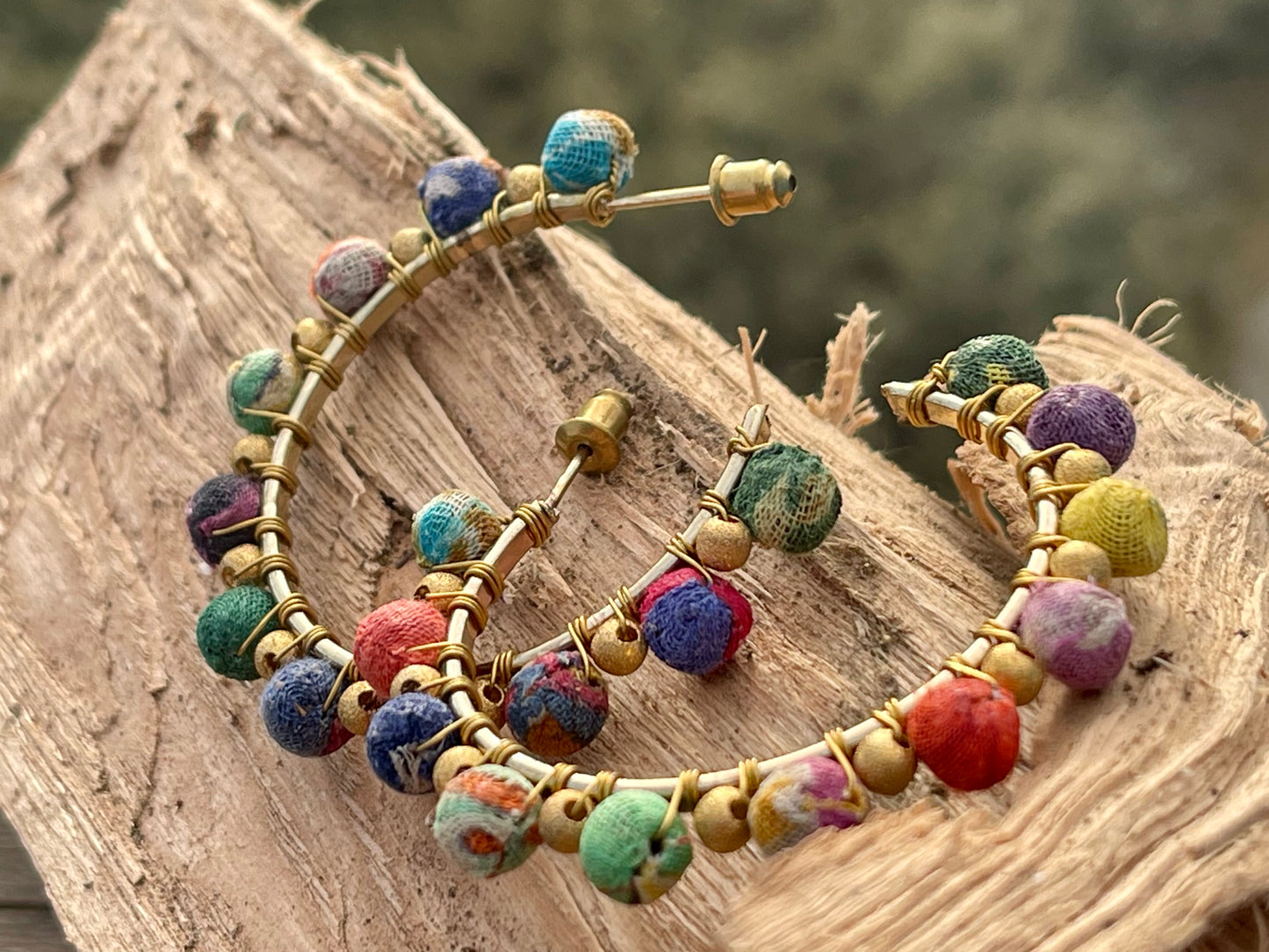 Handmade earrings made from waste textiles