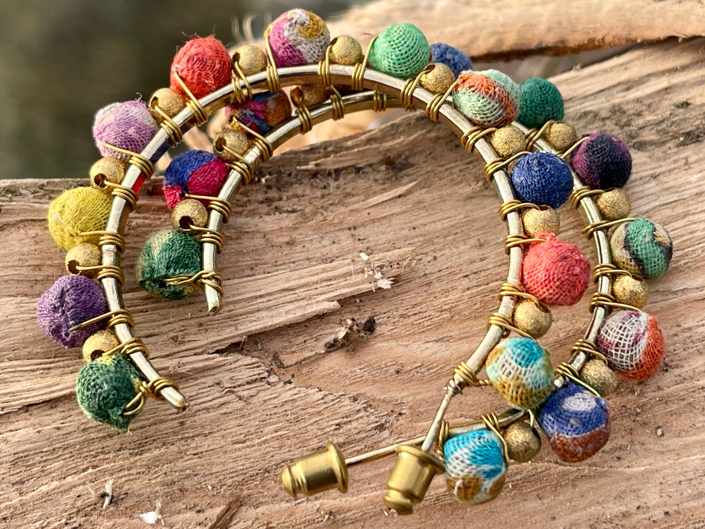 Handmade earrings made from waste textiles