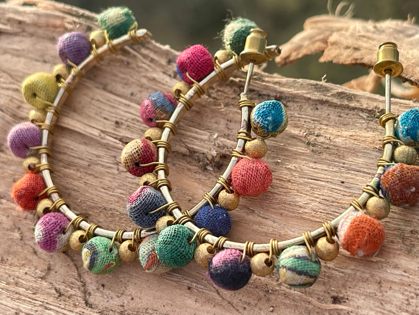 Handmade earrings made from waste textiles