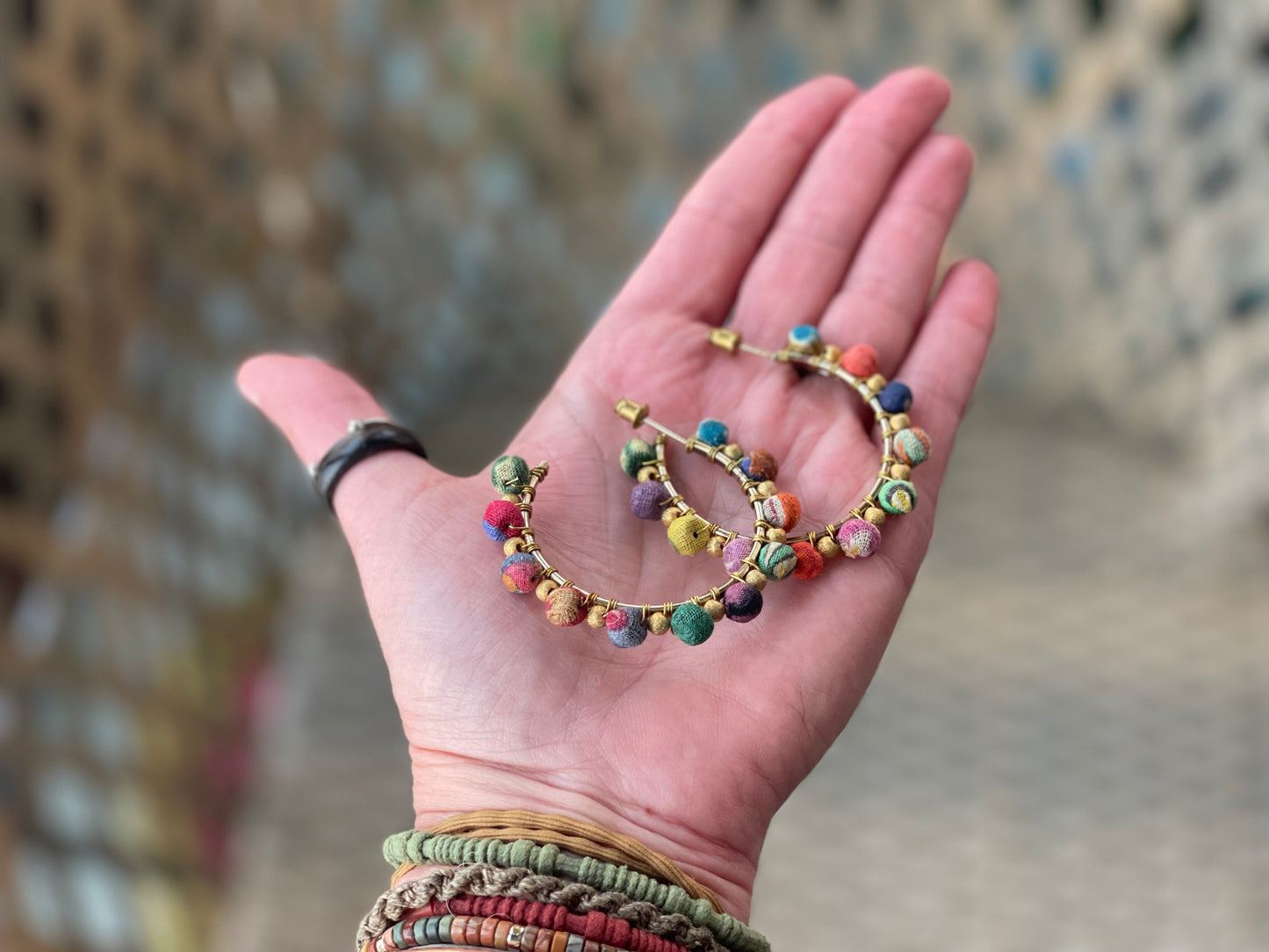 Handmade earrings made from waste textiles