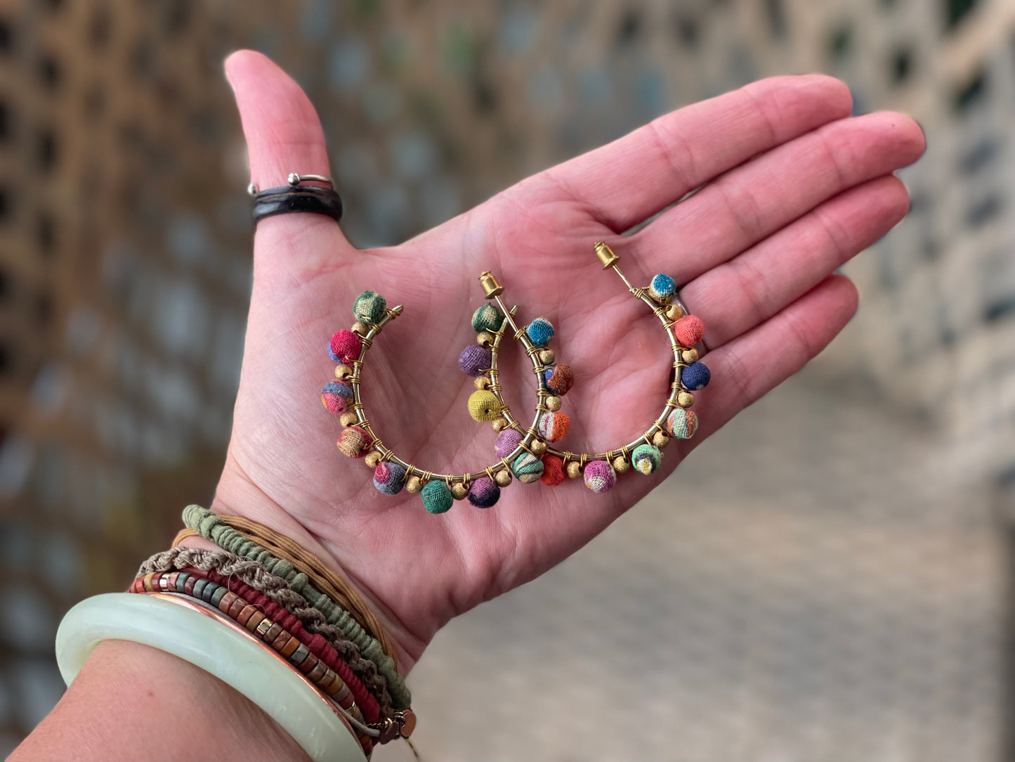 Handmade earrings made from waste textiles