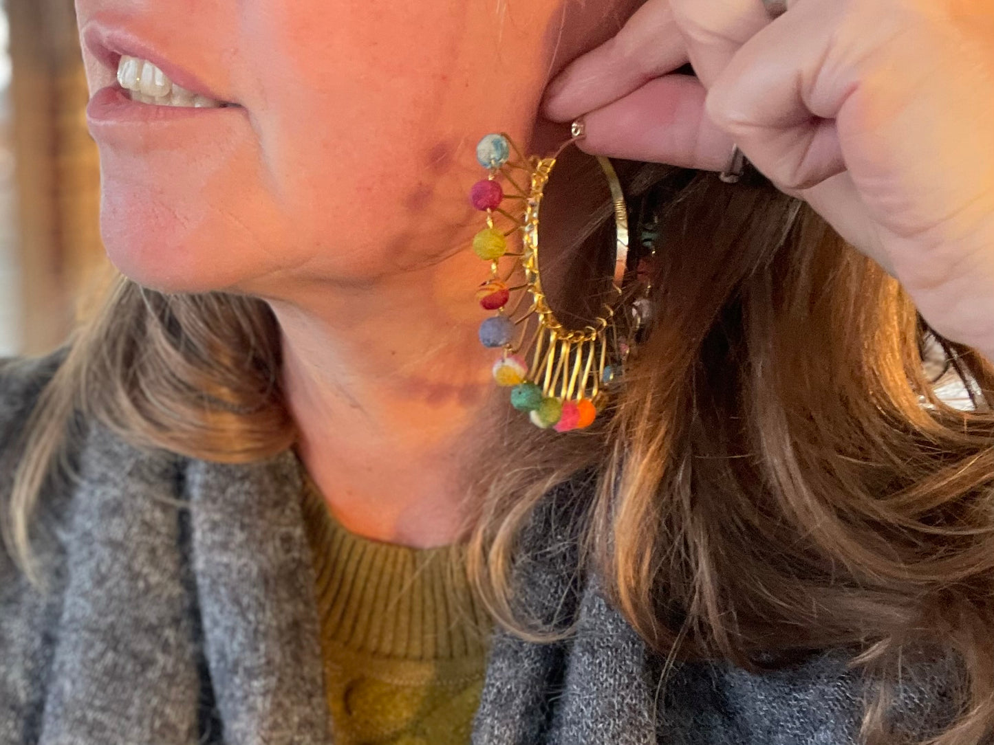 Handmade earrings made from waste textiles
