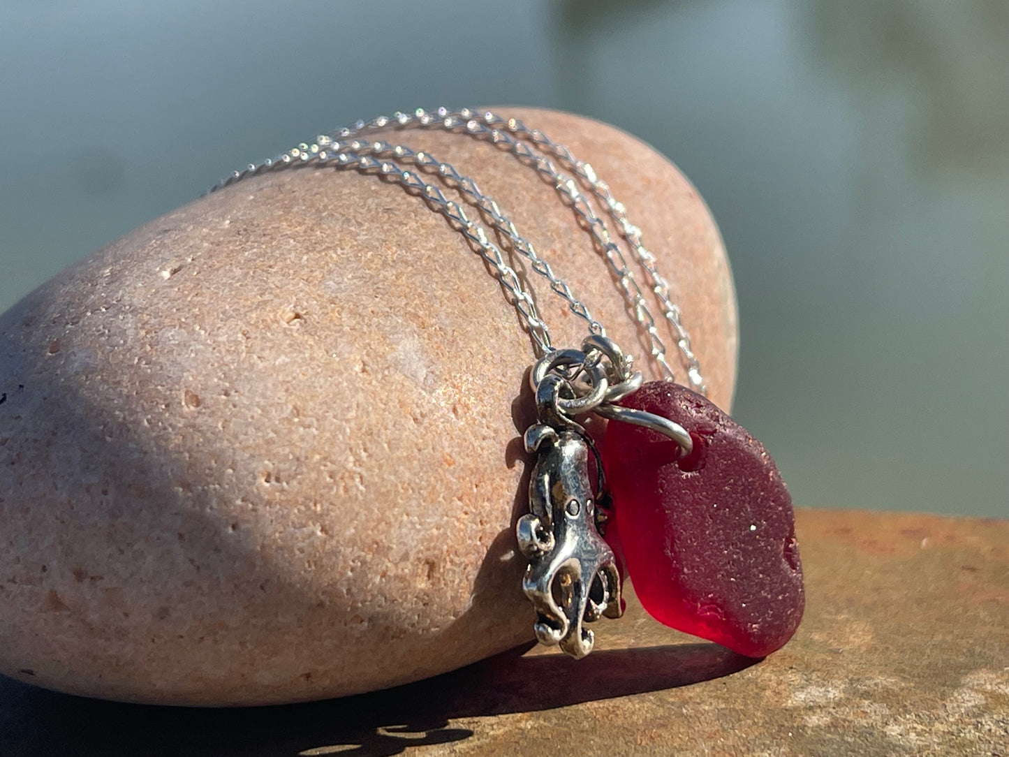Eco friendly sea glass necklace on a sterling silver chain showcasing a little octopus. Octopus pendant, octopus necklace, ethical jewellery