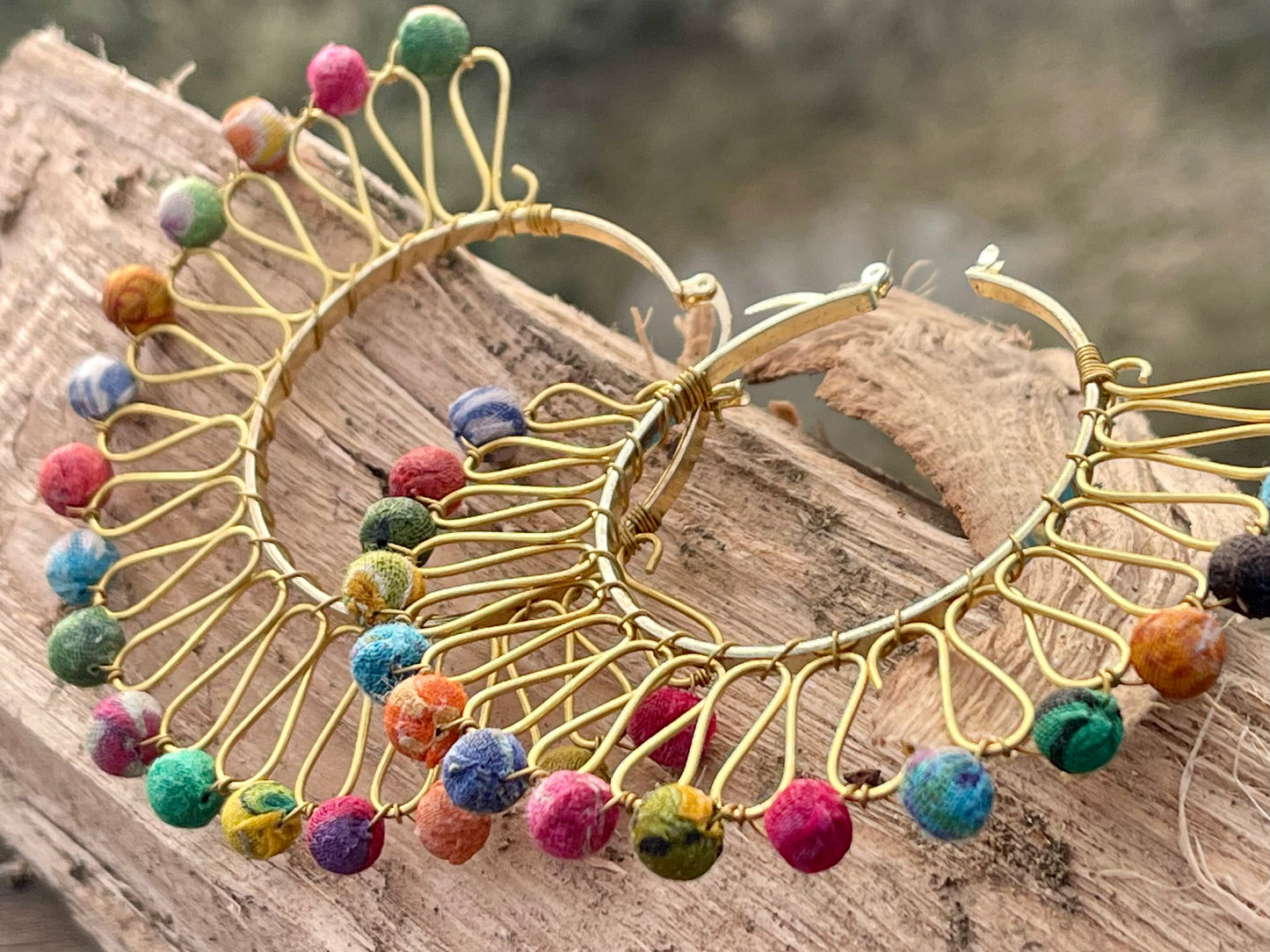 Handmade earrings made from waste textiles