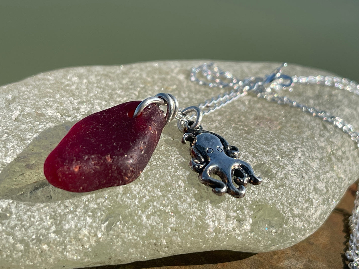 Eco friendly sea glass necklace on a sterling silver chain showcasing a little octopus. Octopus pendant, octopus necklace, ethical jewellery