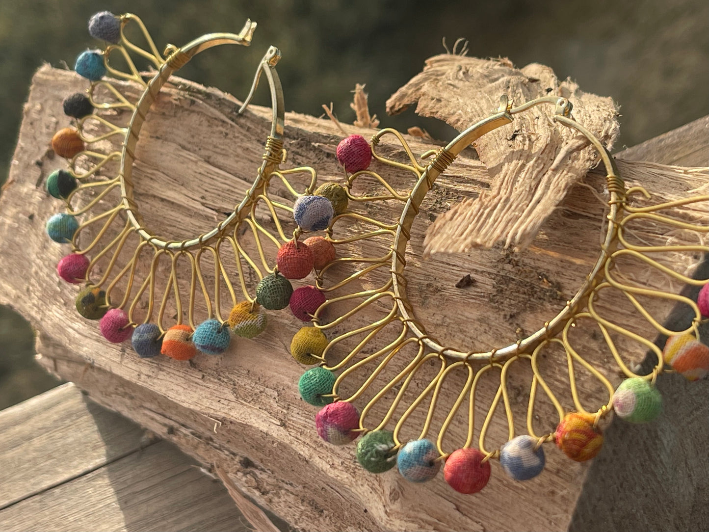 Handmade earrings made from waste textiles