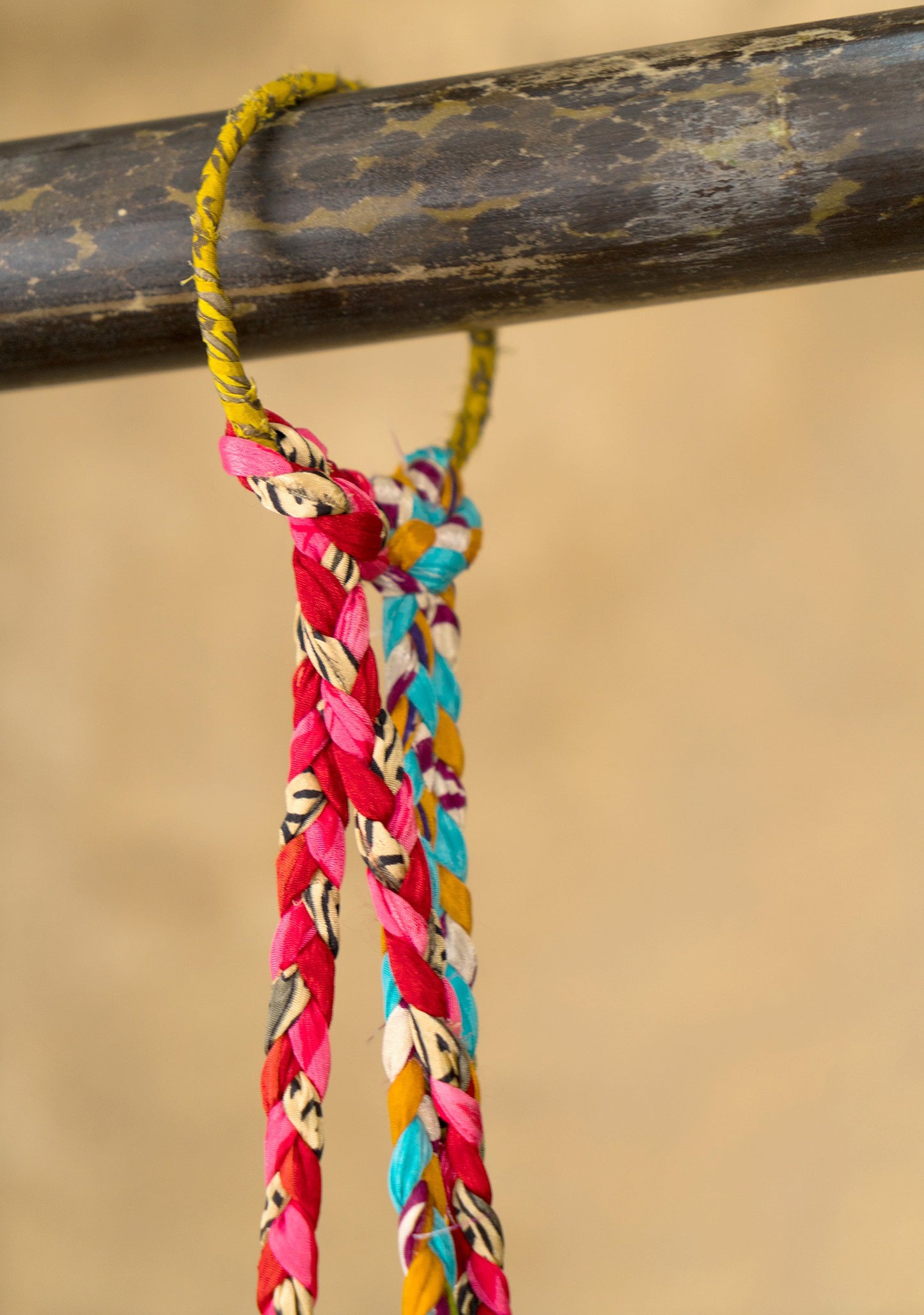 Hanging plant holder made from recycled saris. Eco friendly plant hanger. Colourful home decor.