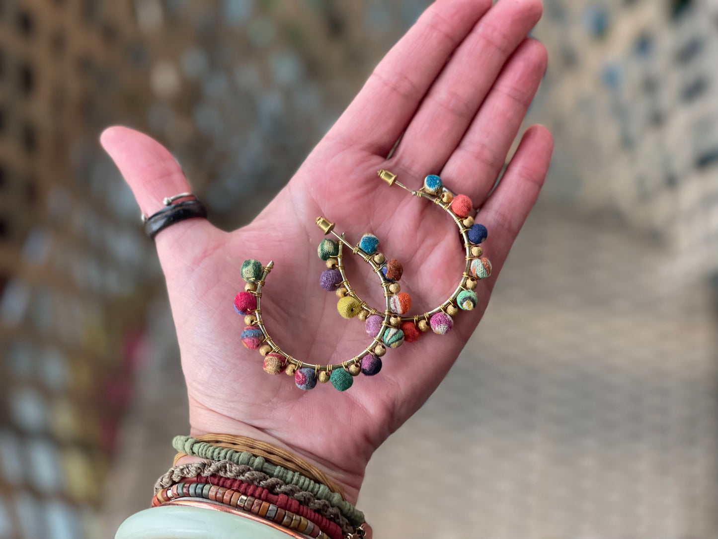 Handmade earrings made from waste textiles