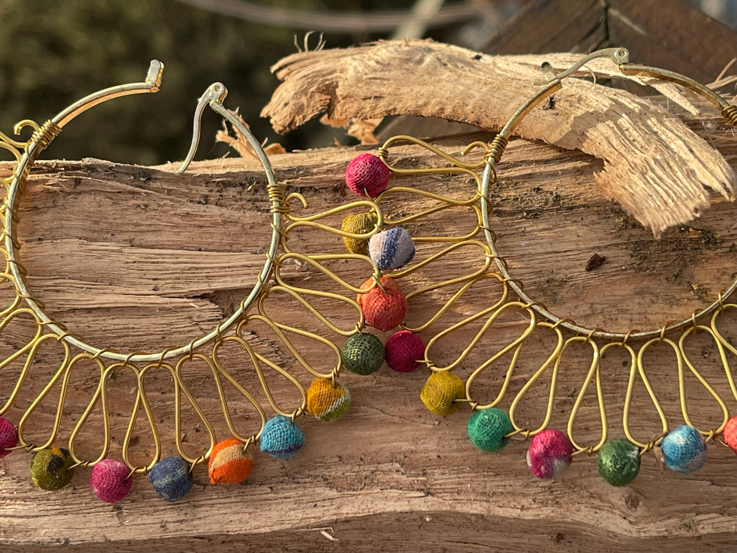 Handmade earrings made from waste textiles