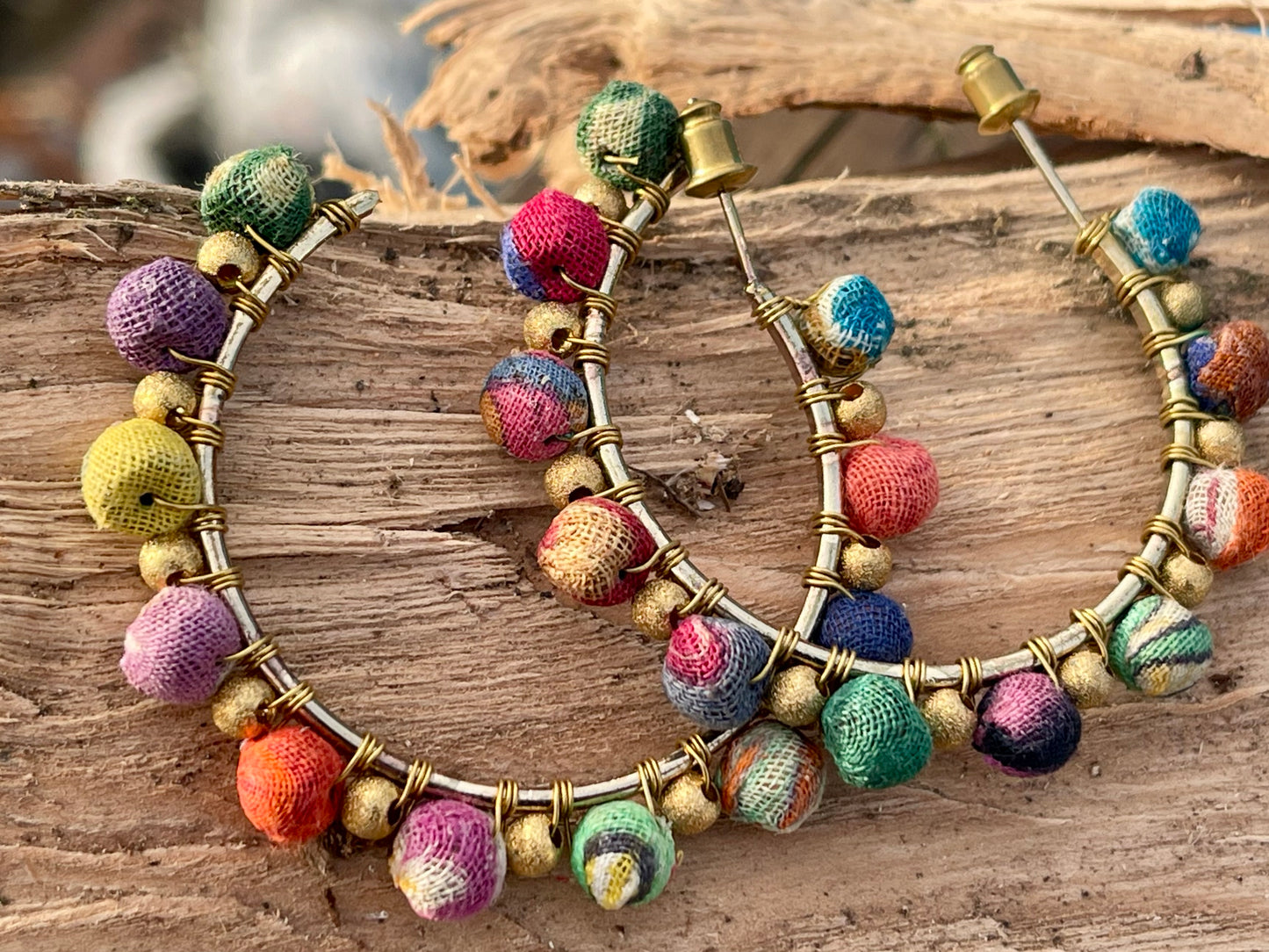 Handmade earrings made from waste textiles