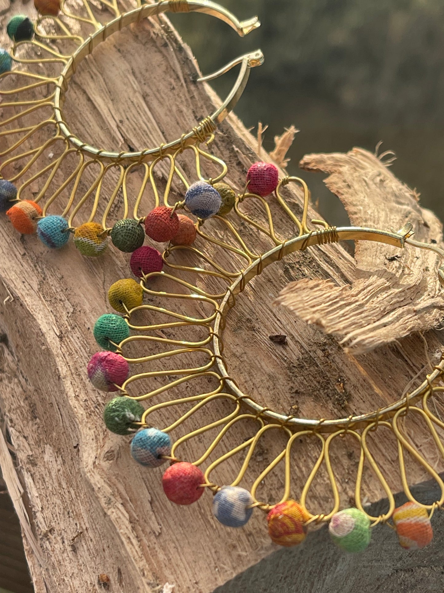 Handmade earrings made from waste textiles