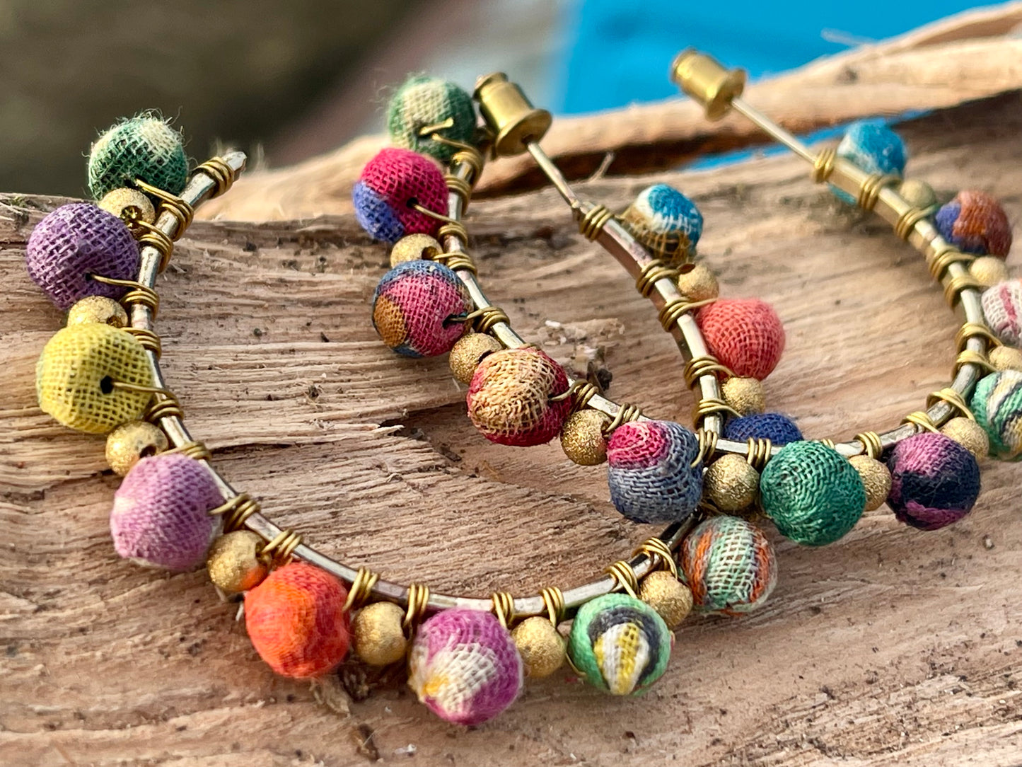 Handmade earrings made from waste textiles