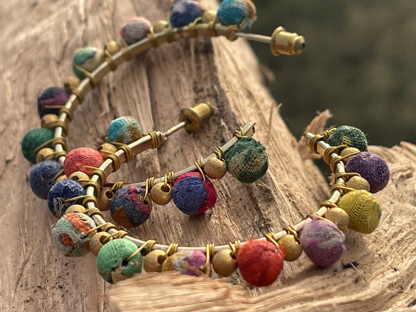 Handmade earrings made from waste textiles