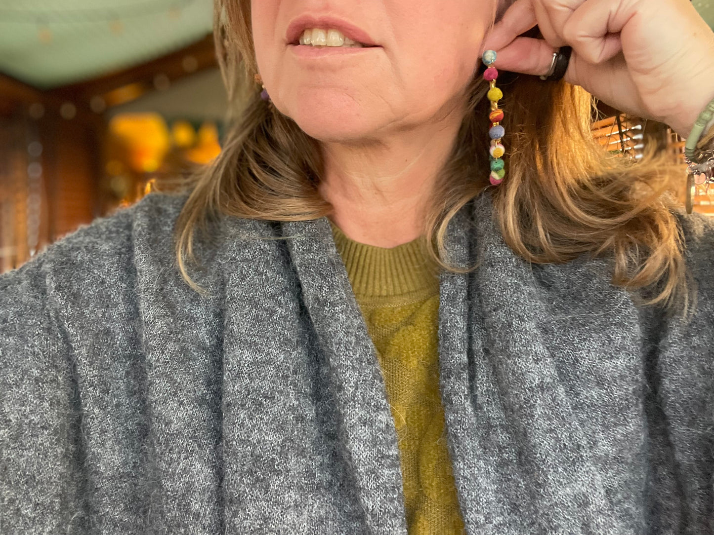 Handmade earrings made from waste textiles