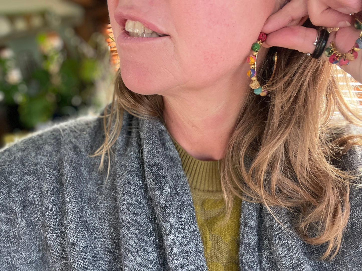 Handmade earrings made from waste textiles