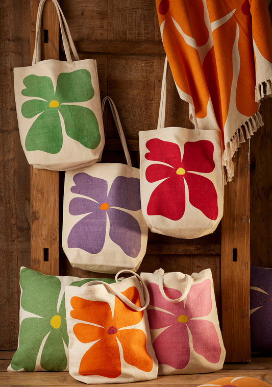 Bright joyful recycled cotton bags with bold flower prints. Long handles. Thick strong cotton.
