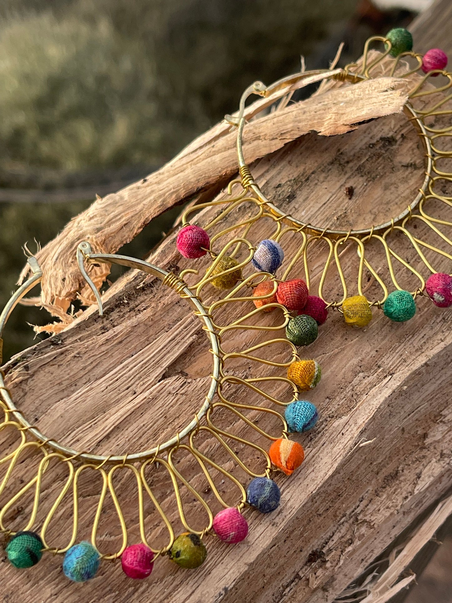 Handmade earrings made from waste textiles