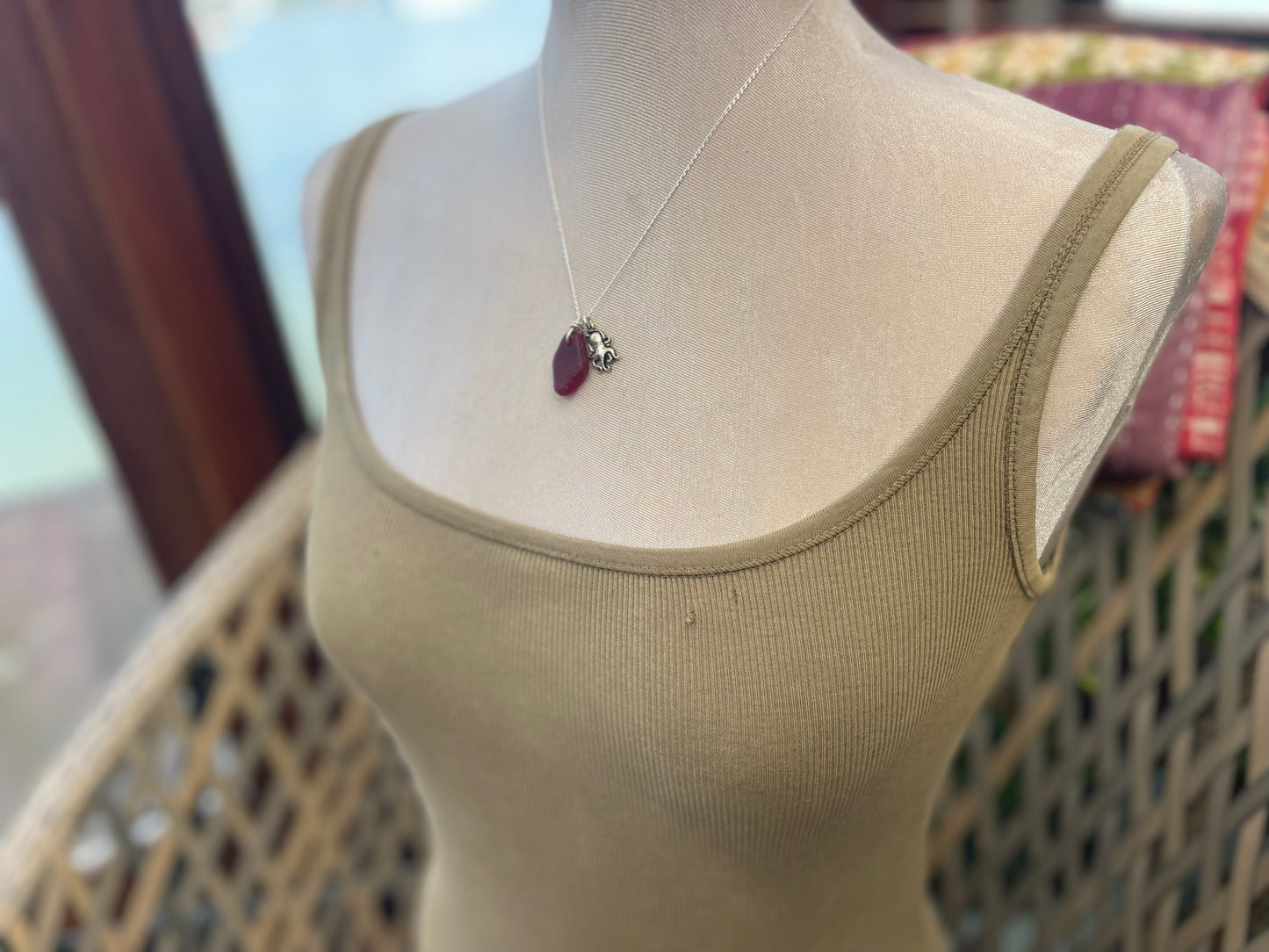 Eco friendly sea glass necklace on a sterling silver chain showcasing a little octopus. Octopus pendant, octopus necklace, ethical jewellery