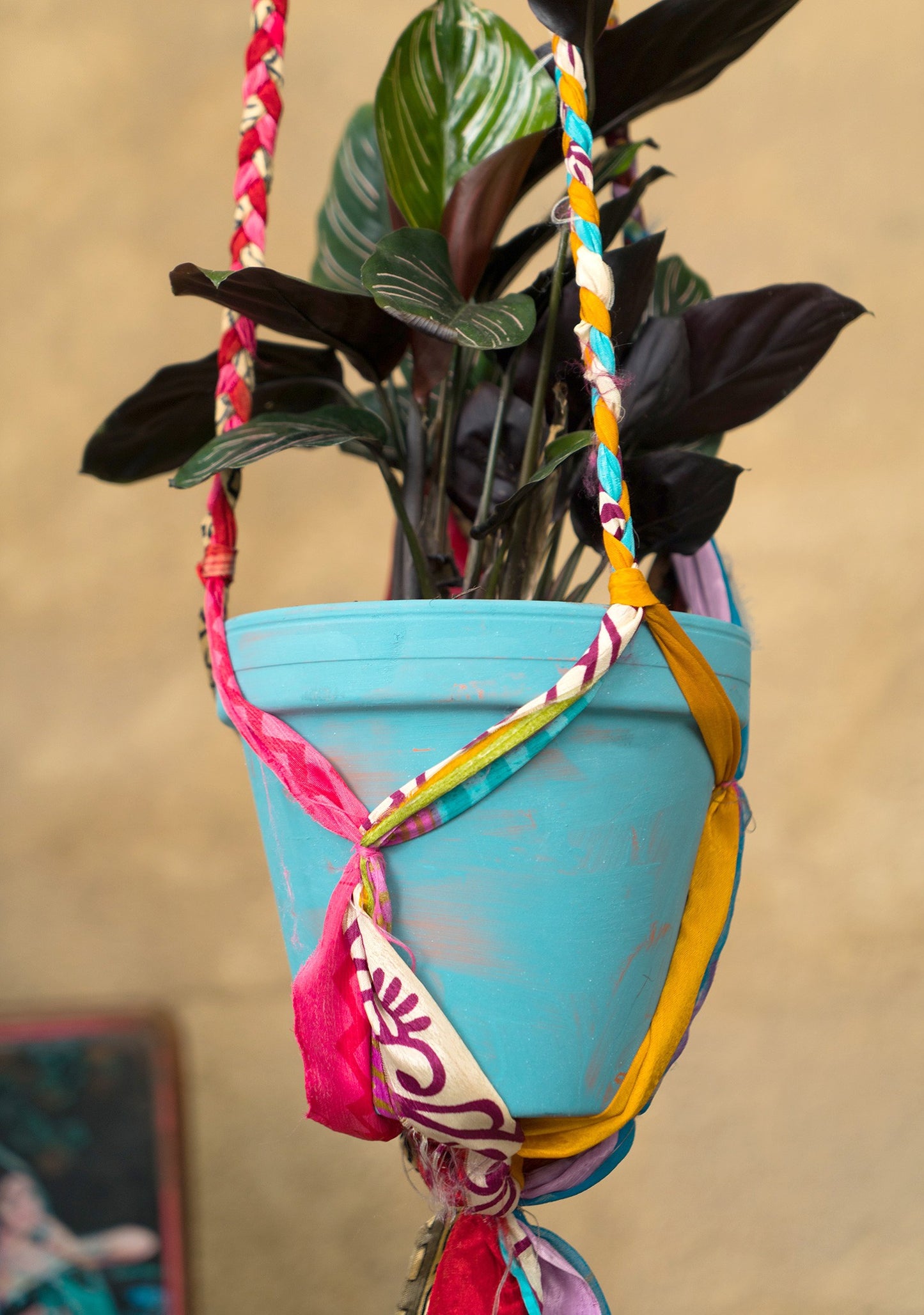 Hanging plant holder made from recycled saris. Eco friendly plant hanger. Colourful home decor.