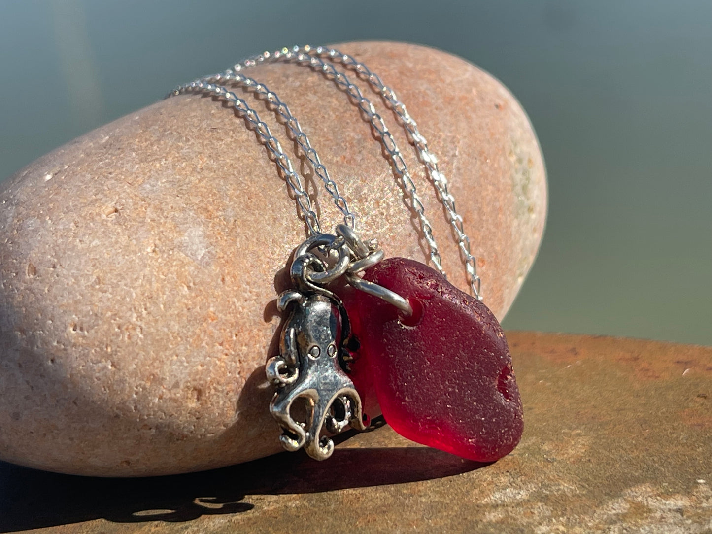 Eco friendly sea glass necklace on a sterling silver chain showcasing a little octopus. Octopus pendant, octopus necklace, ethical jewellery