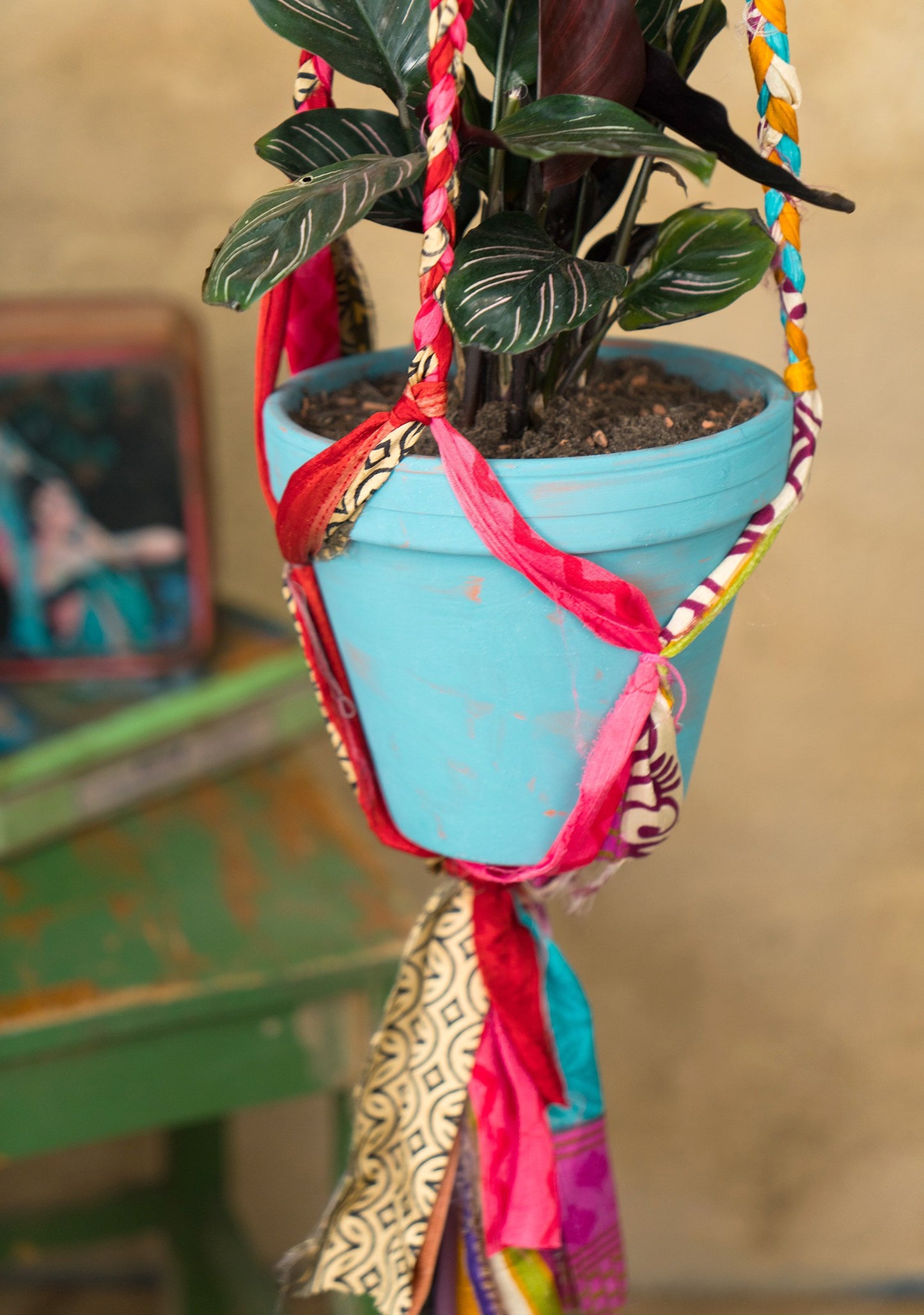 Hanging plant holder made from recycled saris. Eco friendly plant hanger. Colourful home decor.