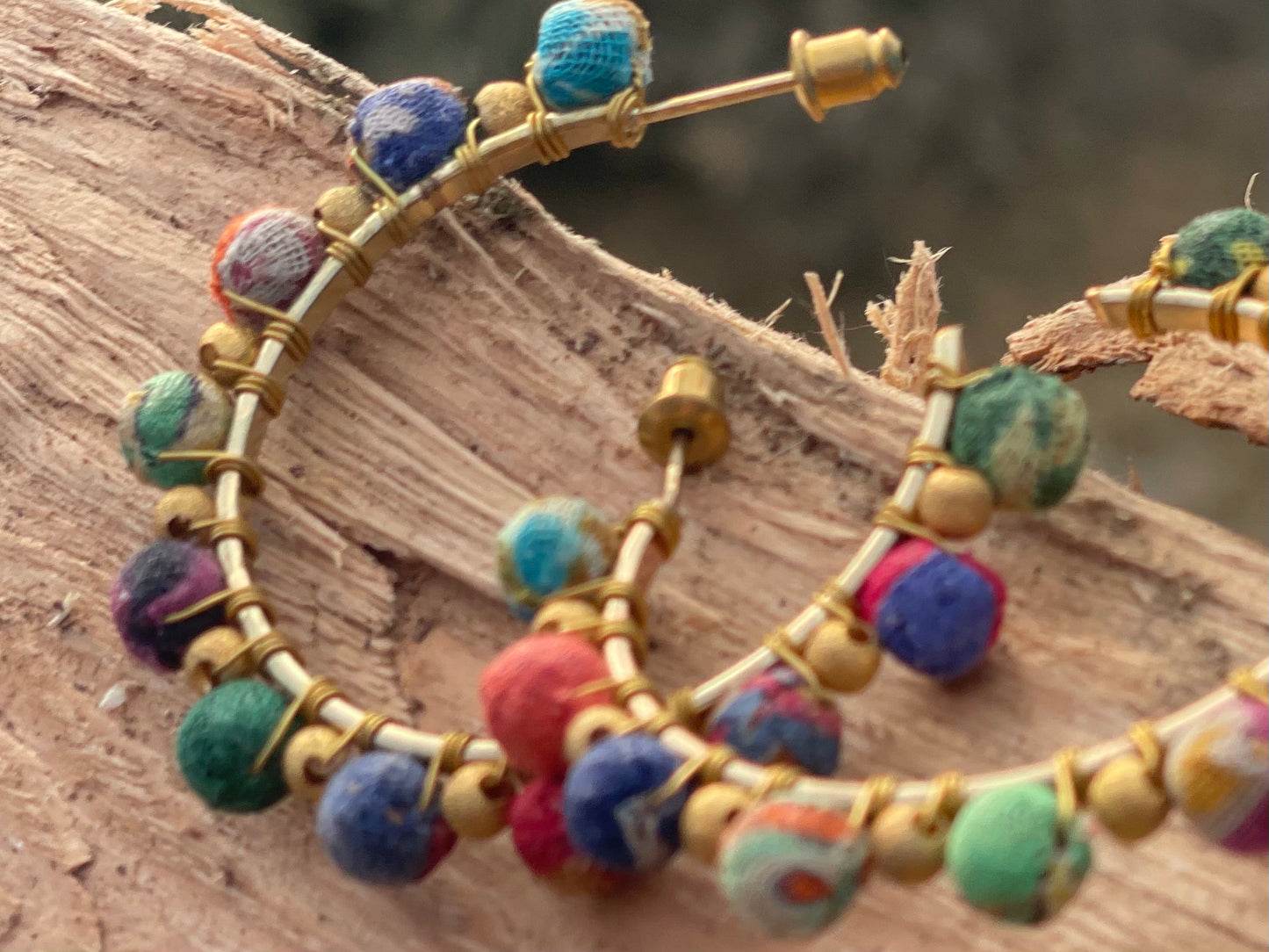 Handmade earrings made from waste textiles